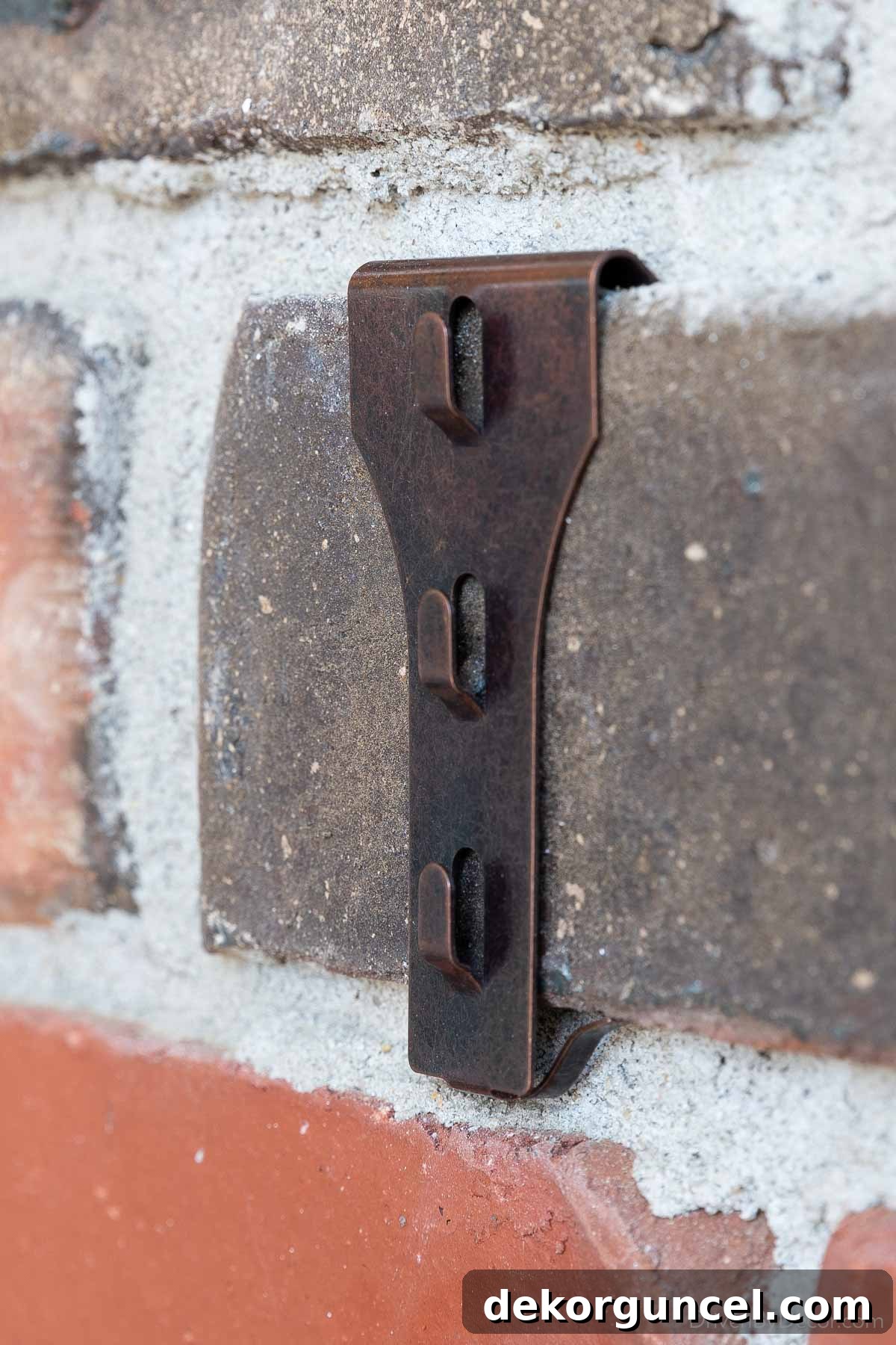 7 Frugal Back Porch Design Secrets 4 Close-up of brick clip-on hangers, demonstrating a damage-free hanging solution
