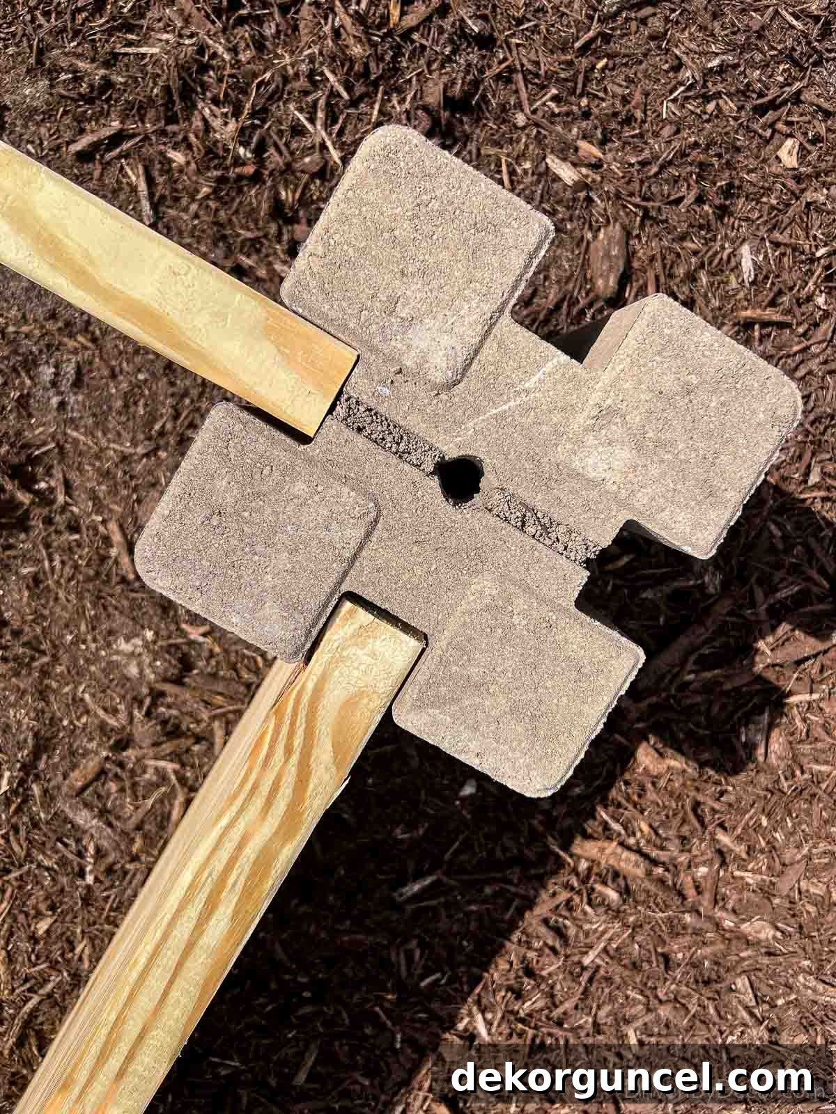 6 Budget-Friendly Raised Garden Bed Ideas 4 The corner blocks and lumber used to make an inexpensive raised garden bed, forming the first layer