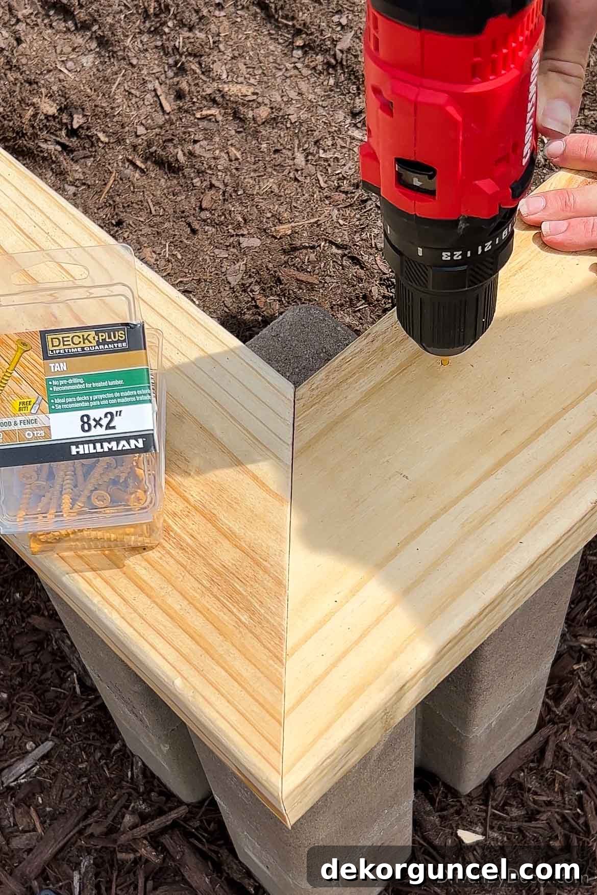 6 Budget-Friendly Raised Garden Bed Ideas 10 Screwing cap onto top of raised garden bed for secure attachment