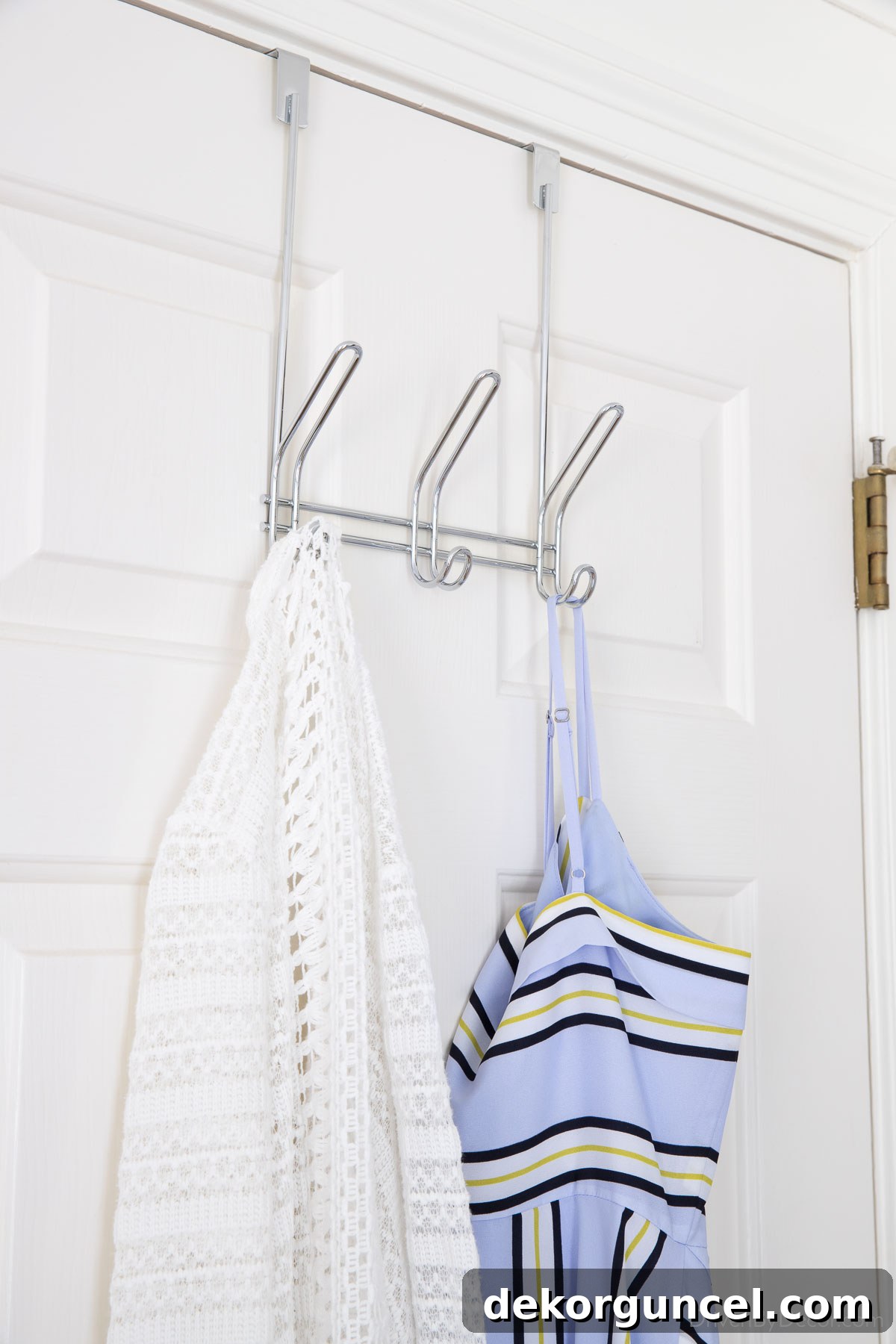 Over-the-door hooks providing convenient storage for clothes, maximizing unused door space