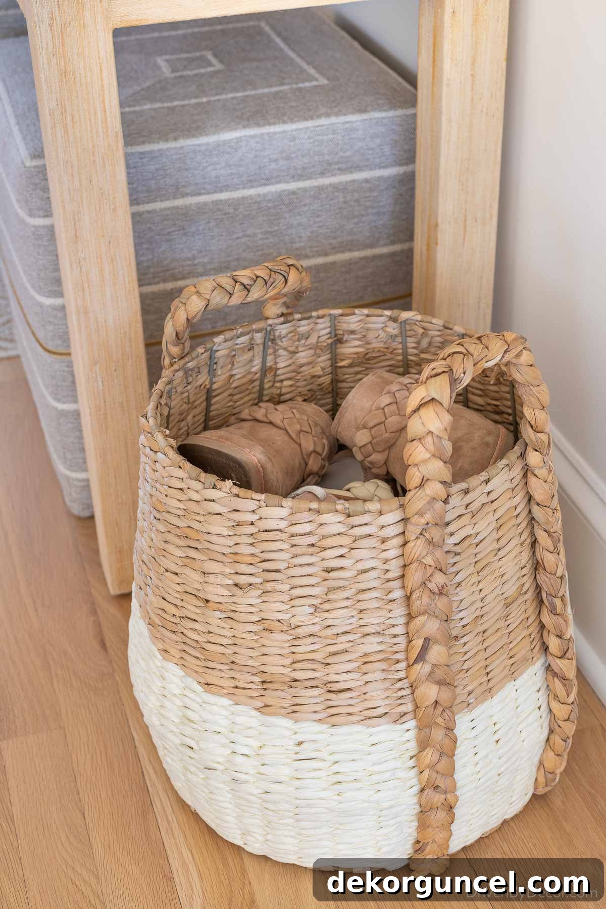 Gorgeous white and natural woven basket, an elegant and practical shoe storage solution for an entryway or closet