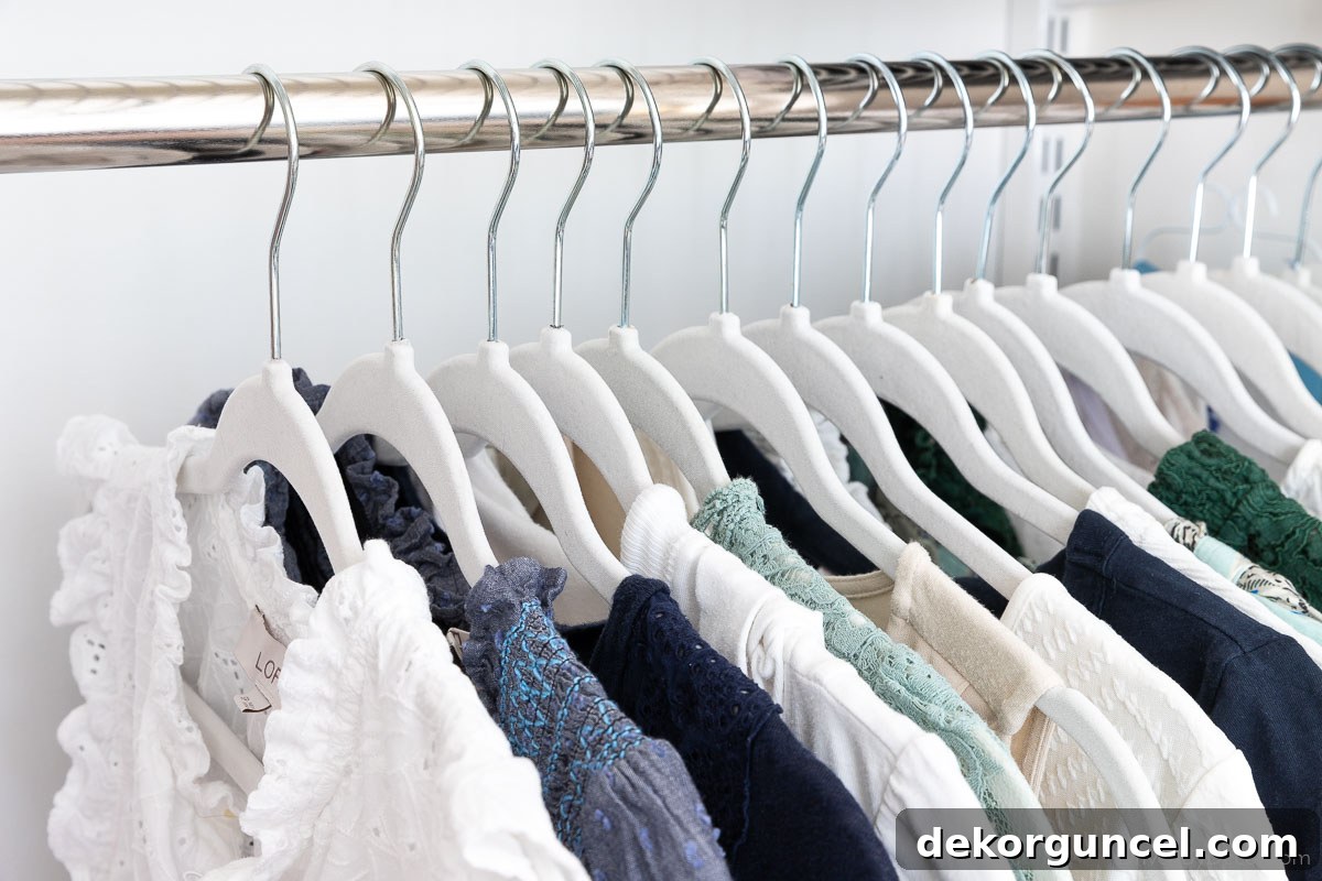 Organized closet showcasing matching velvet space-saving hangers, highlighting improved aesthetics and efficiency