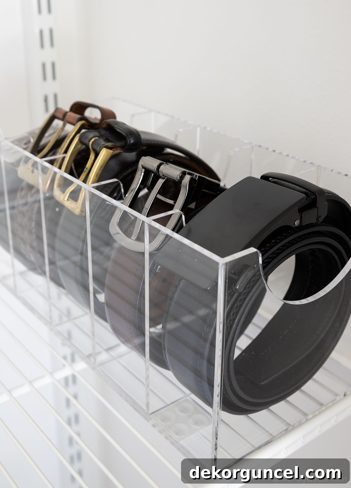 Acrylic belt organizer with individual compartments, ideal for neat closet or drawer storage