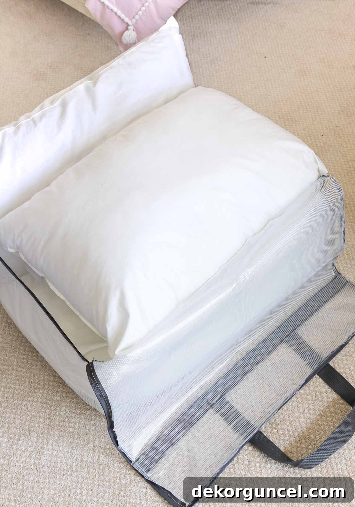Three sleeping pillows perfectly fitted inside an open storage bag for dust-free closet organization