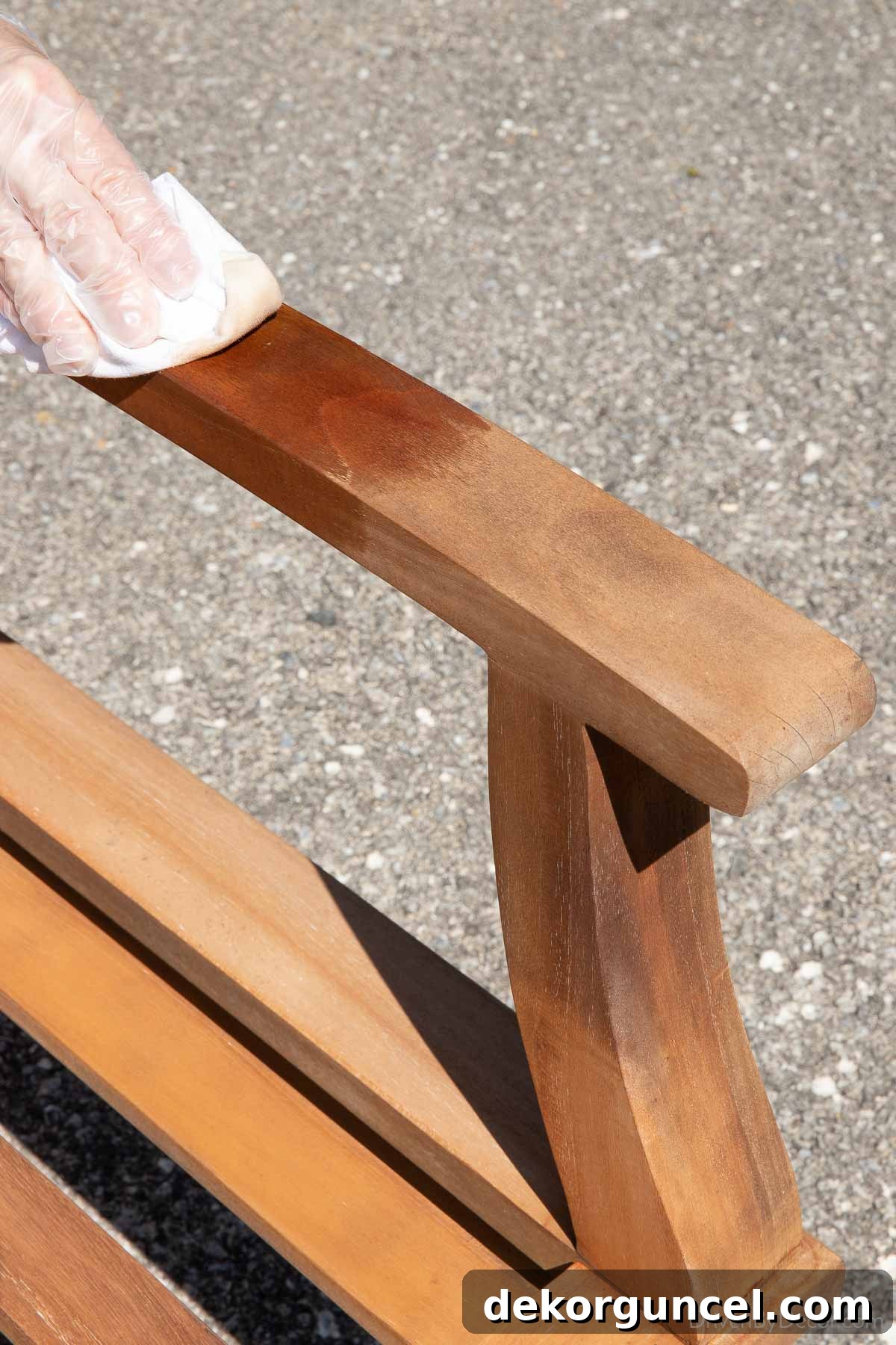 Banish Pollen: Essential Tools for a Spotless Porch & Outdoor Furniture 10 Applying teak conditioner to chair arm showing how the conditioner darkens the color and enhances the wood grain