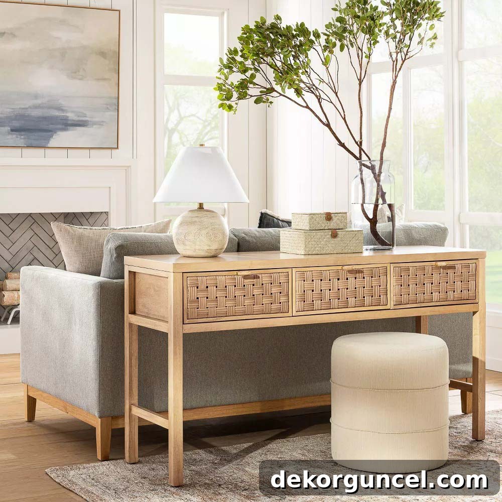 Natural console with woven drawers behind couch