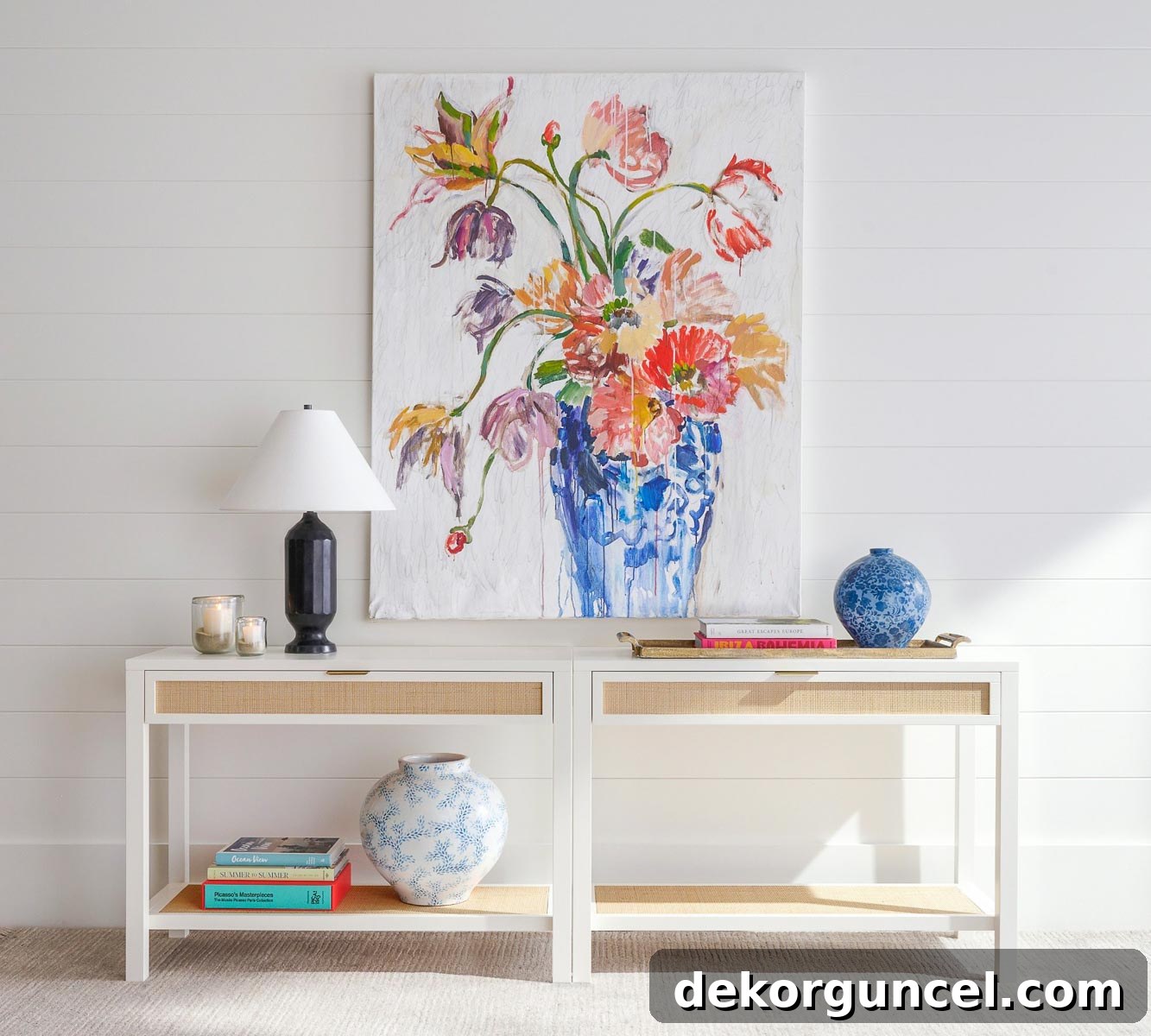 Two cane console tables placed side by side to create one long sofa table