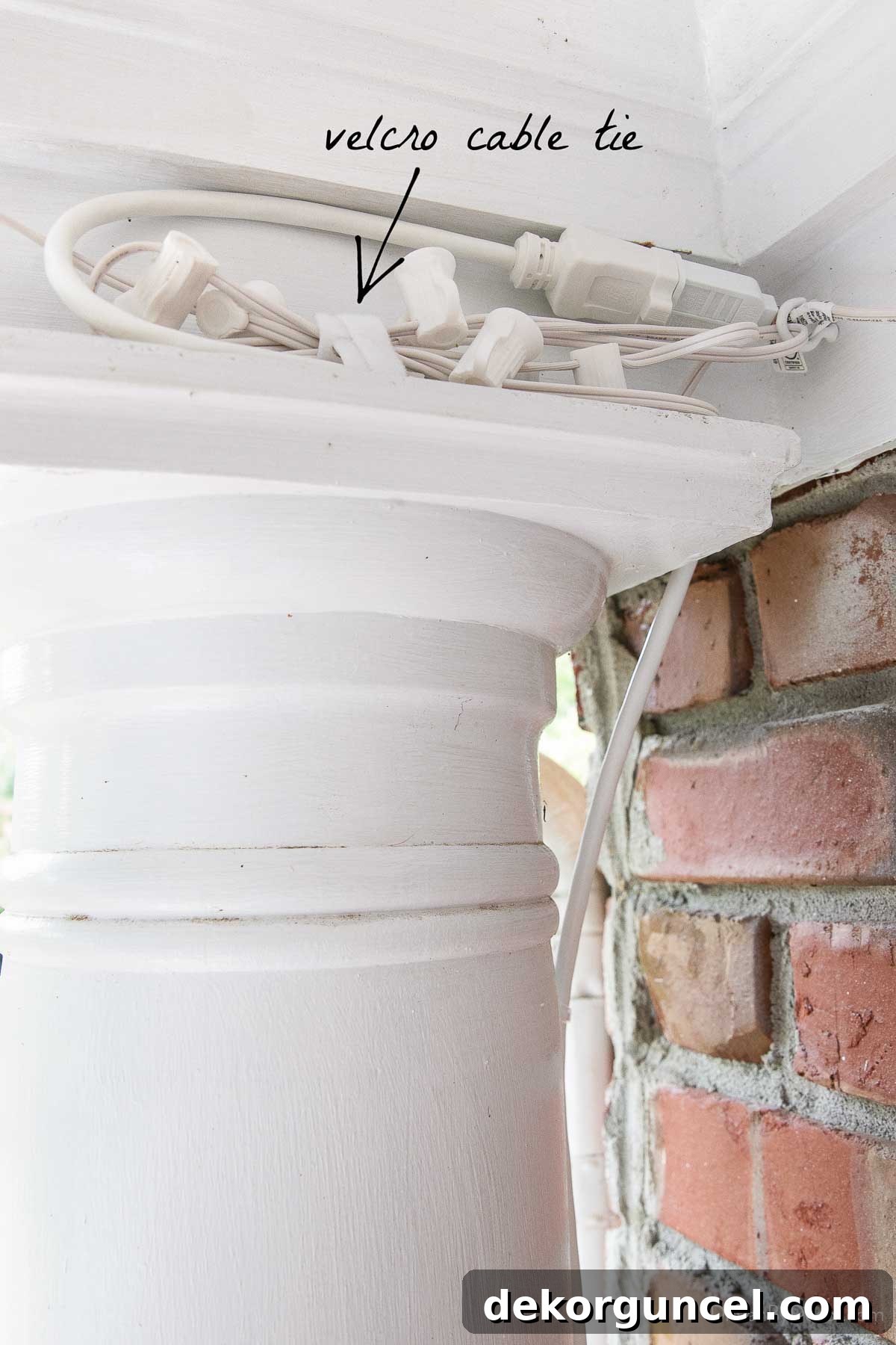 Effortless String Light Decor for Your Covered Patio 11 Velcro cable tie wrapped around extra length of string lights