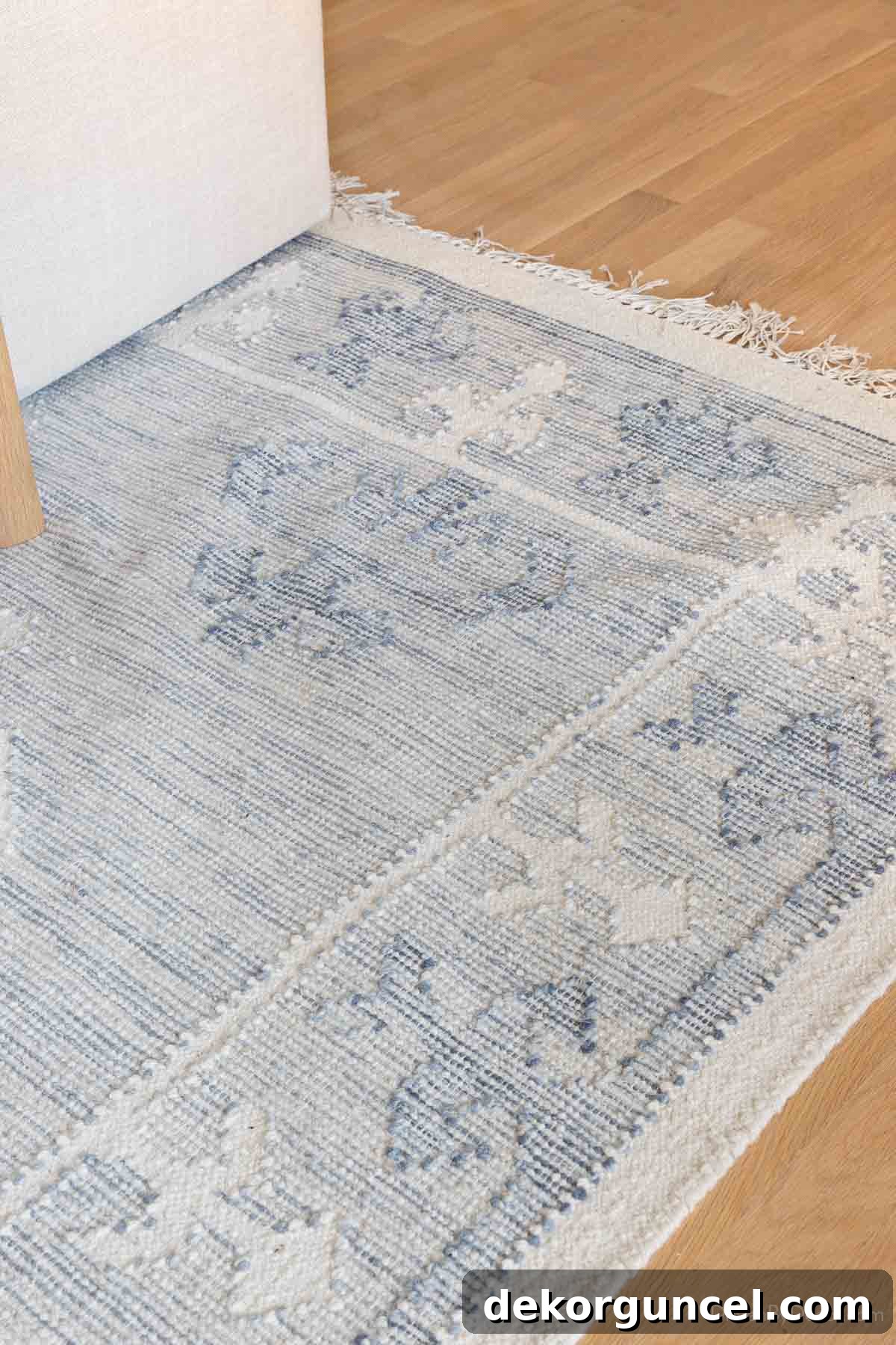 Wrinkled rug without rug pad, demonstrating slipping and bunching issues