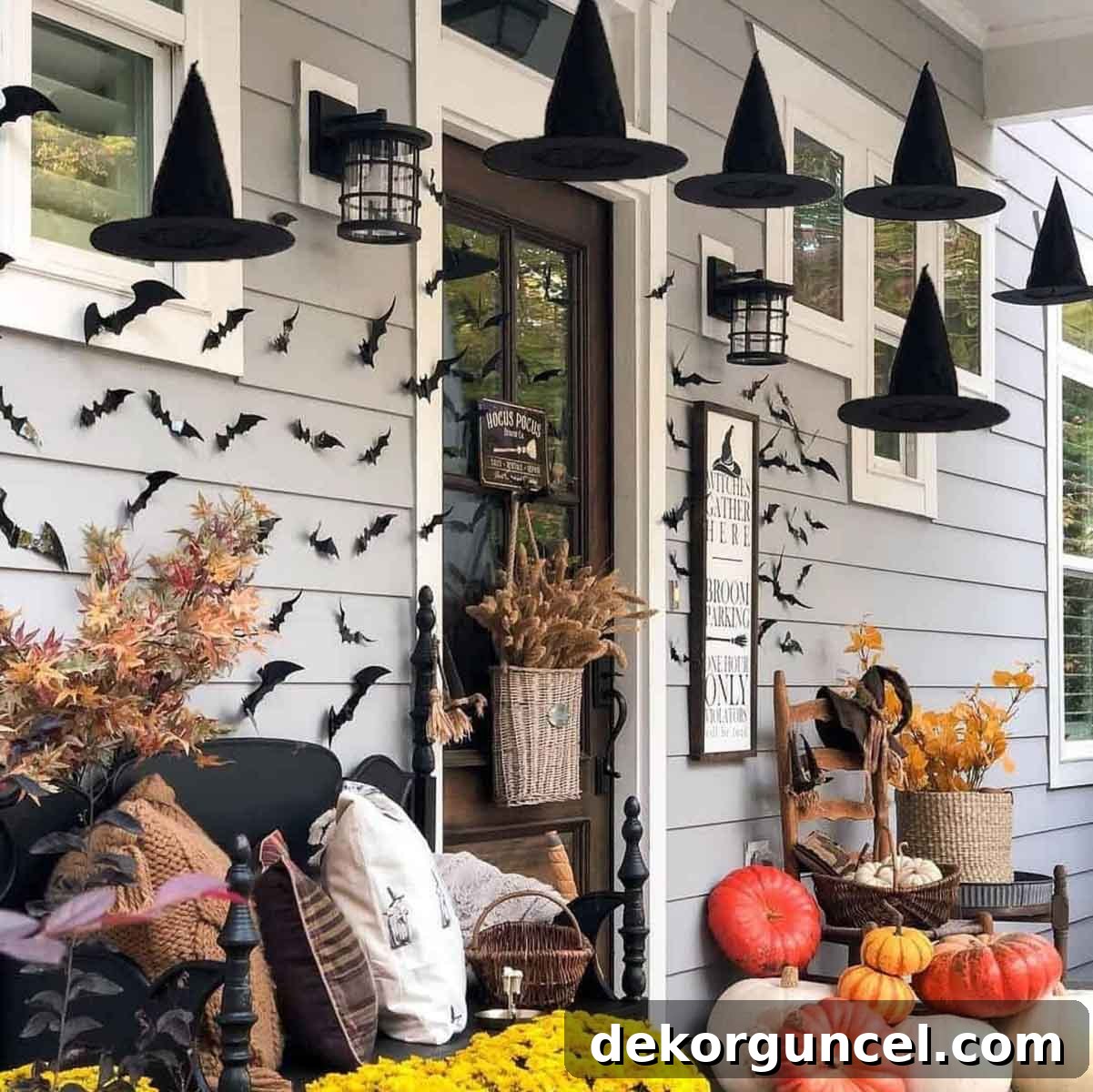 Simple, Spooky, and Fun Halloween Porch Decor Ideas 17 Front porch with bats and hanging witch hats