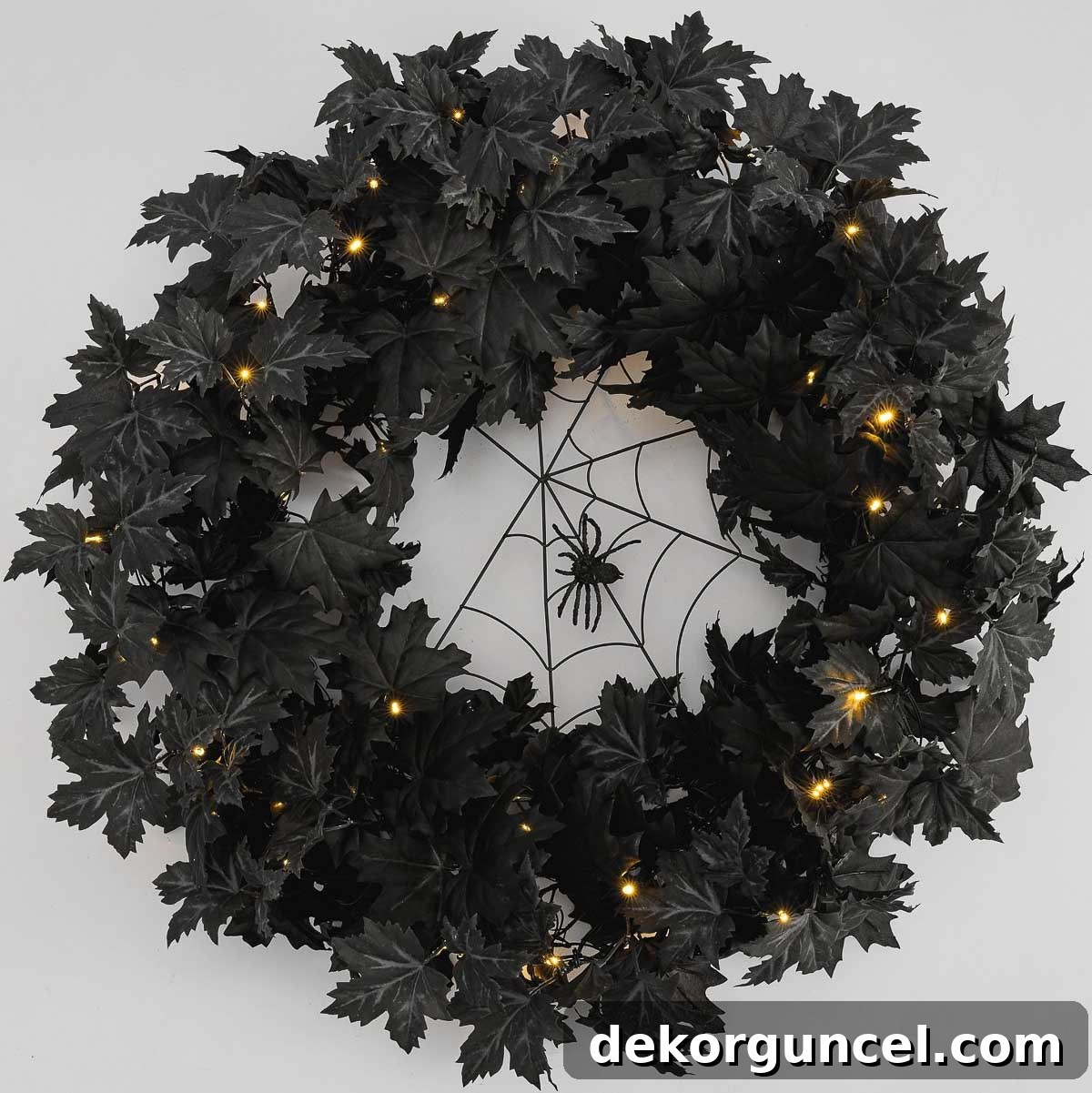 Simple, Spooky, and Fun Halloween Porch Decor Ideas 8 Halloween wreath with black leaves and spider web
