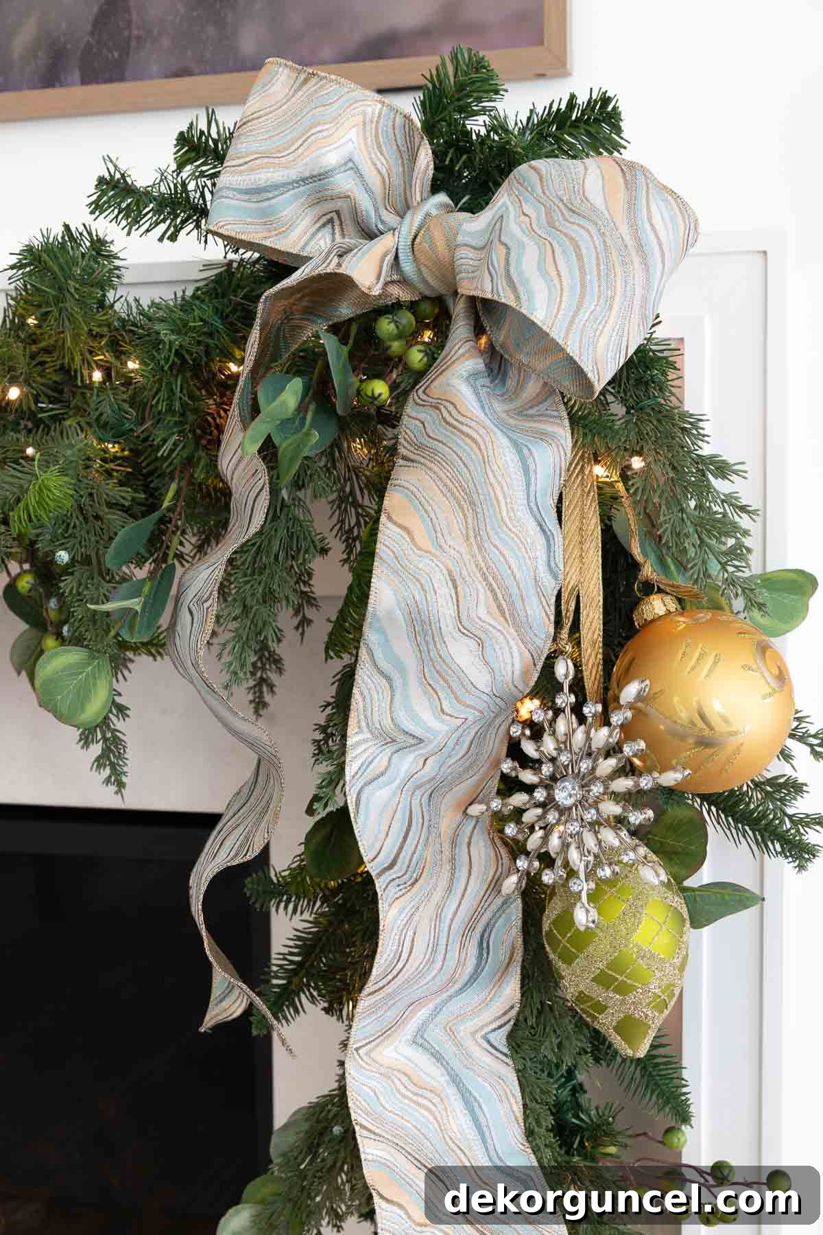 Large bow on end of fireplace mantel garland