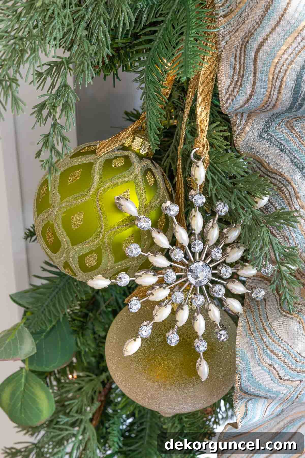 Snowflake and ball ornaments hung on garland