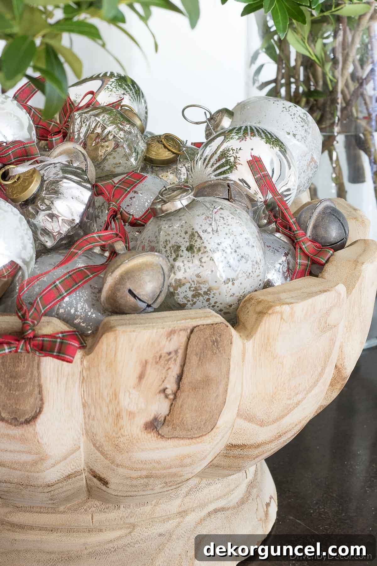 Wood bowl filled with ornaments as console table decor