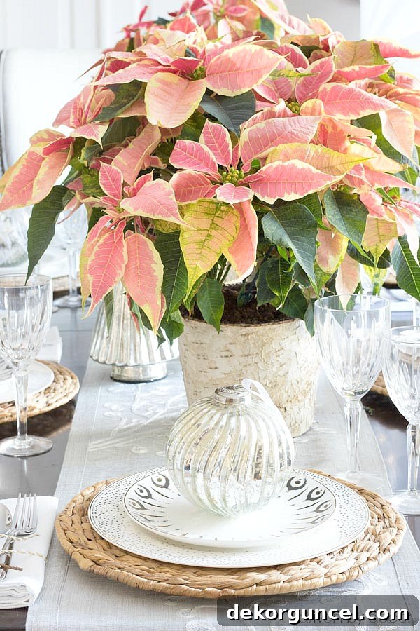 An oversized ornament adorns each plate on this Christmas tablescape