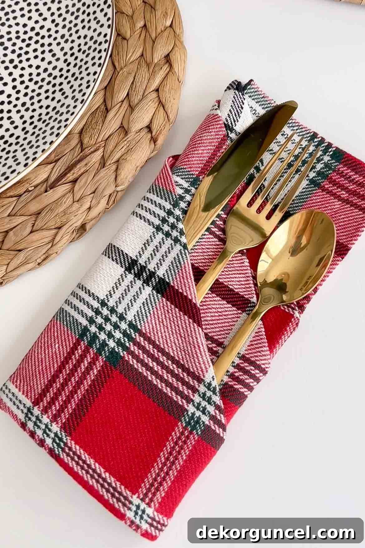 Folded Christmas napkin to create pocket for silverware