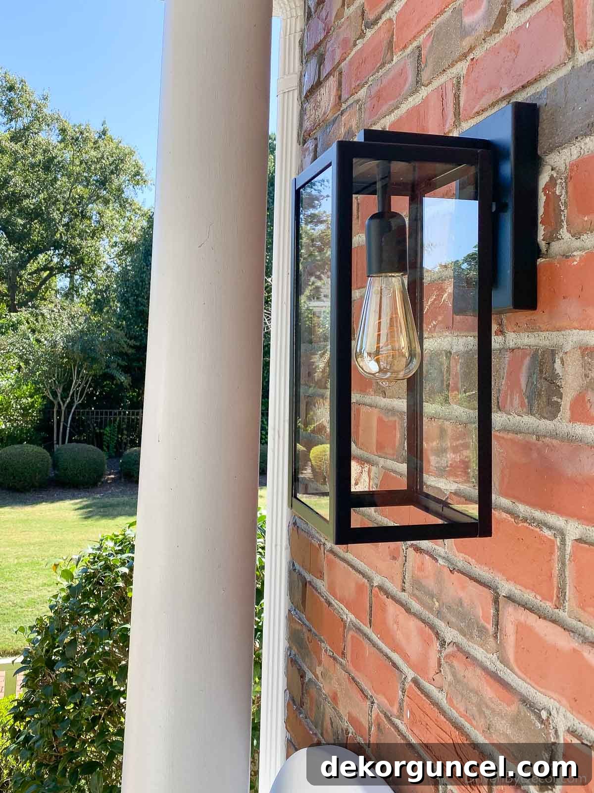 Our newly installed budget-friendly black matte outdoor sconces, enhancing the back porch
