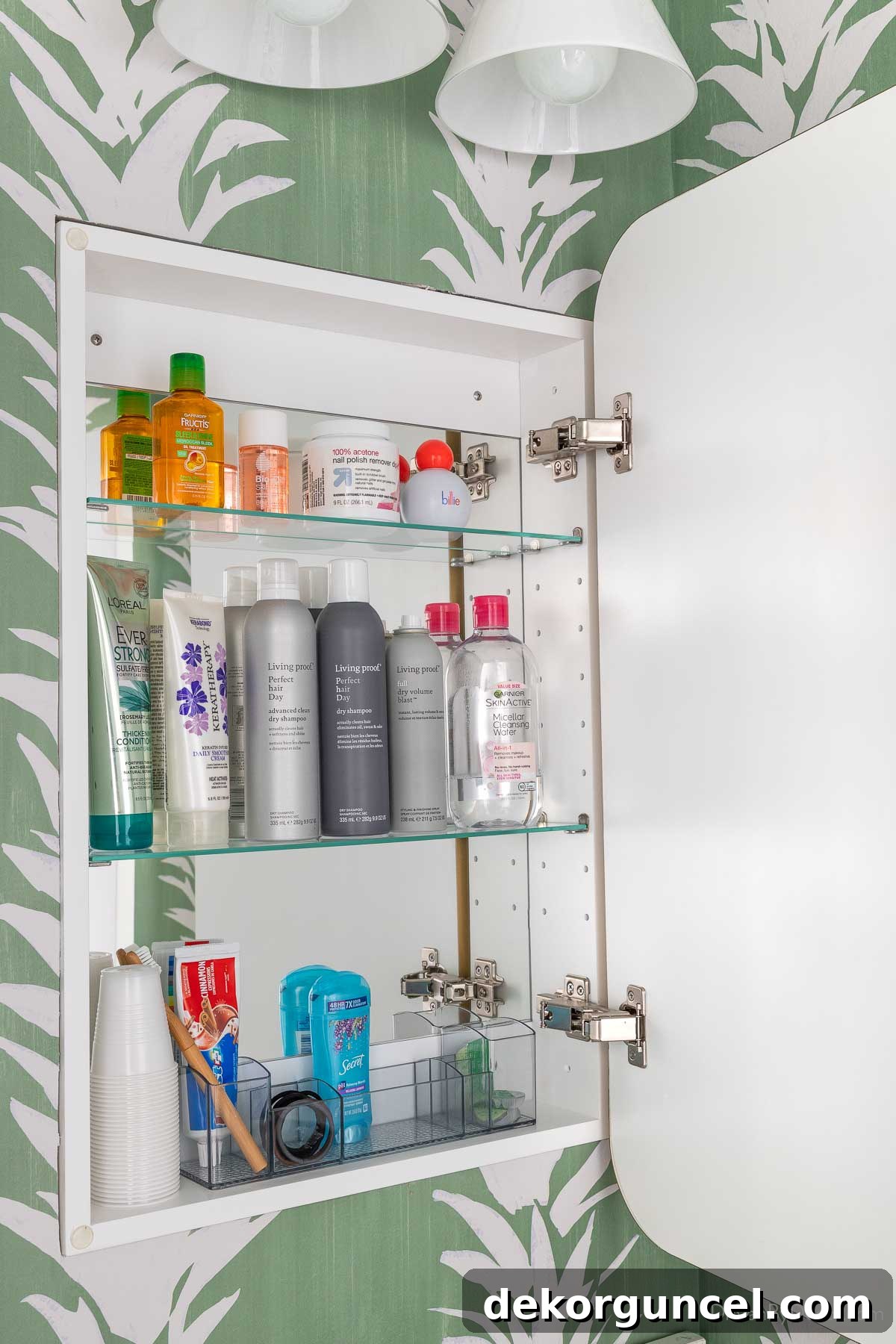 Organized storage of toiletries inside a medicine cabinet mirror, revealing ample hidden space for personal items