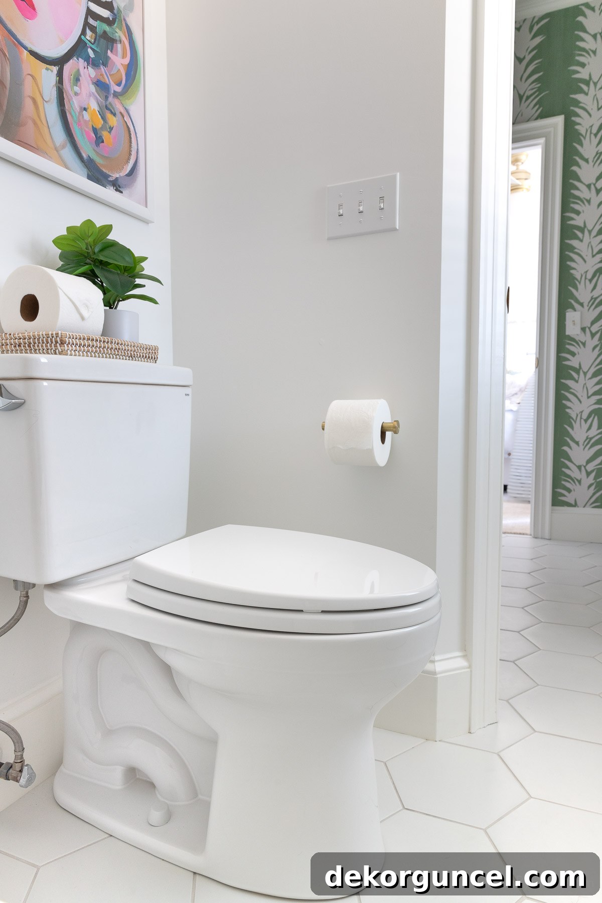 Modern elongated, comfort height Toto toilet in the newly renovated Jack and Jill bathroom, showing its sleek design