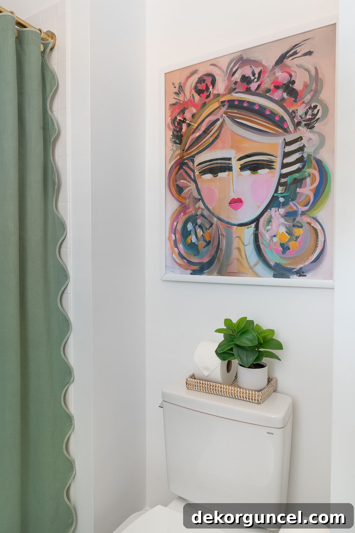 Art print in a white frame hung above the toilet in a Jack and Jill bathroom, adding a decorative touch