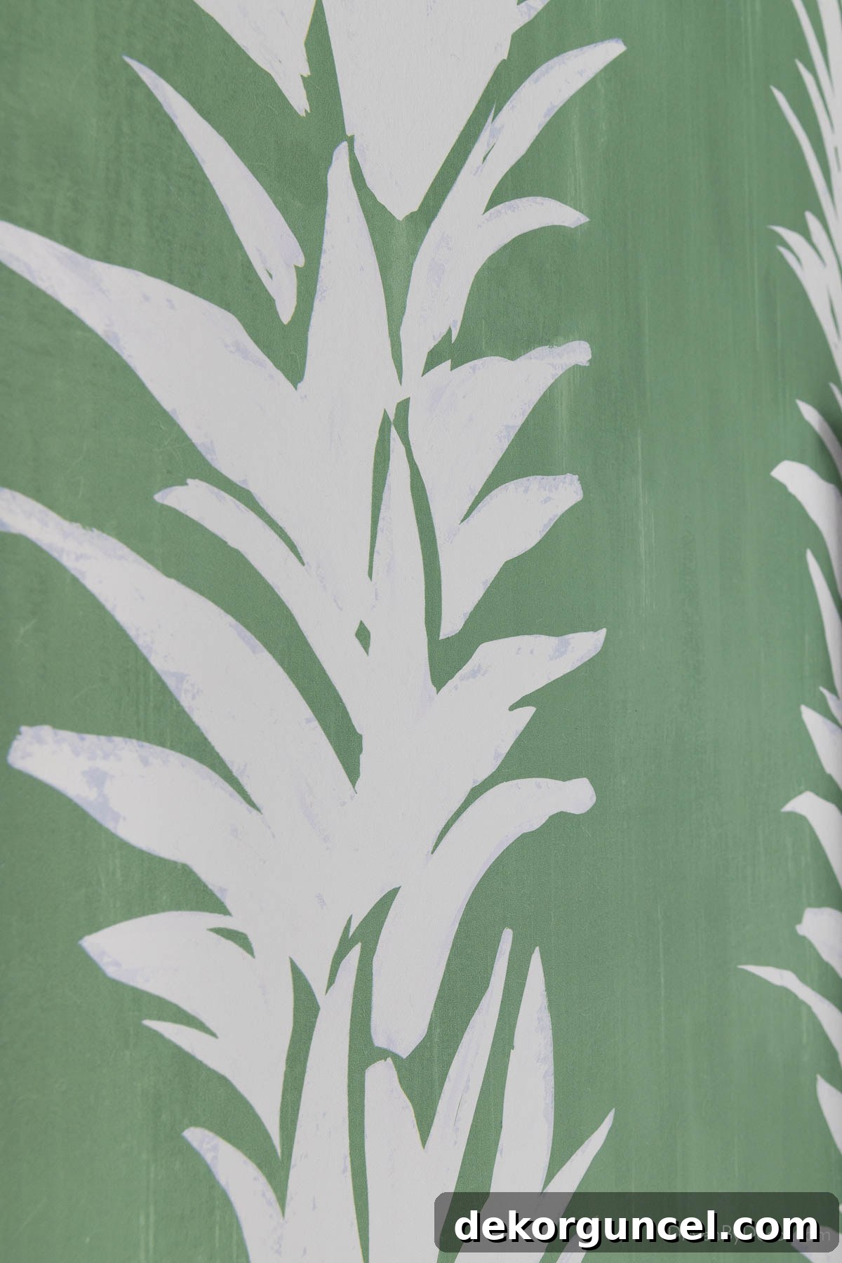 Green and white lotus motif wallpaper with a watercolor effect, adding calm and personality to the bathroom