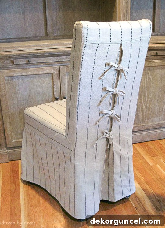 Love the corseted slipcovers on these dining chairs - the ties are so cute!