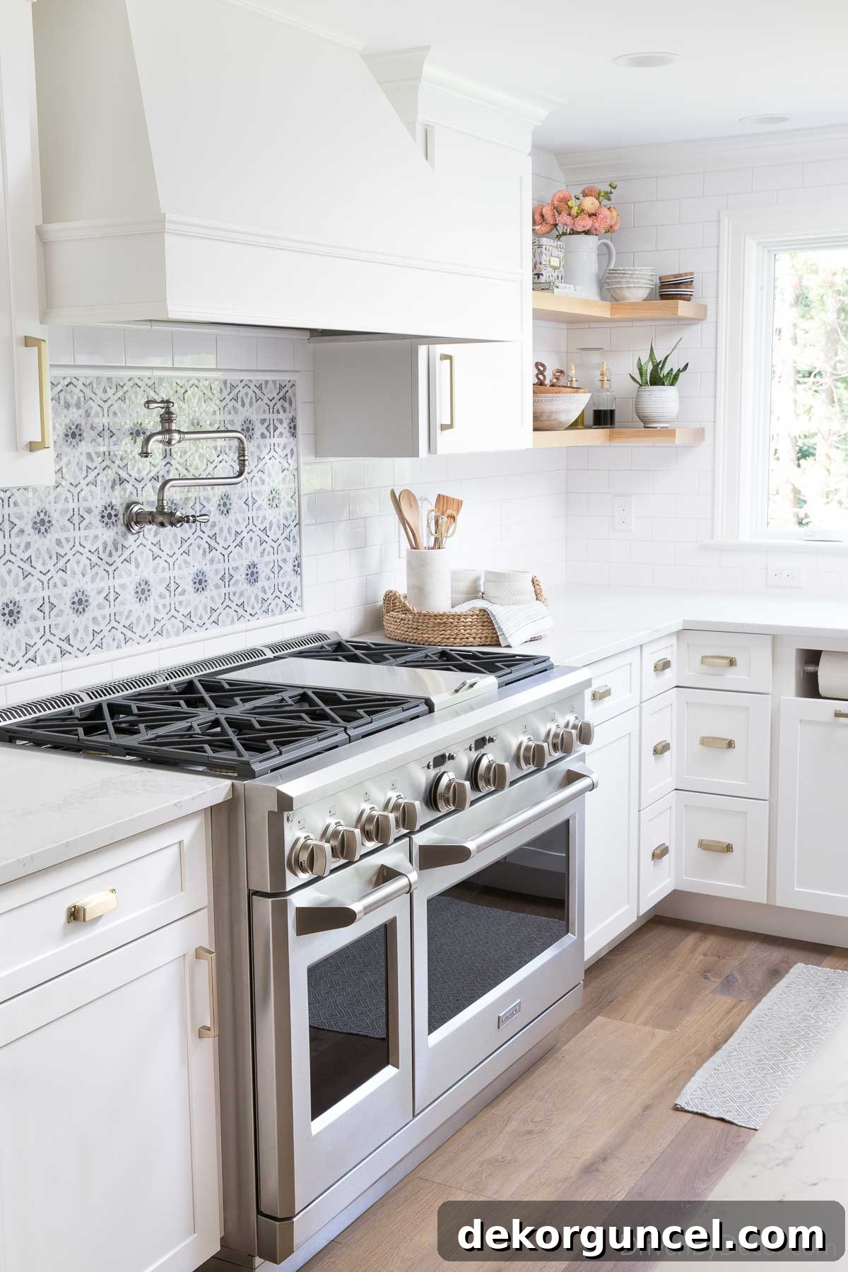 Induction Versus Gas Unlock Your Kitchens Potential 2 A 48 inch stainless gas range, a key feature in a modern kitchen remodel, symbolizing gourmet cooking and sleek design.