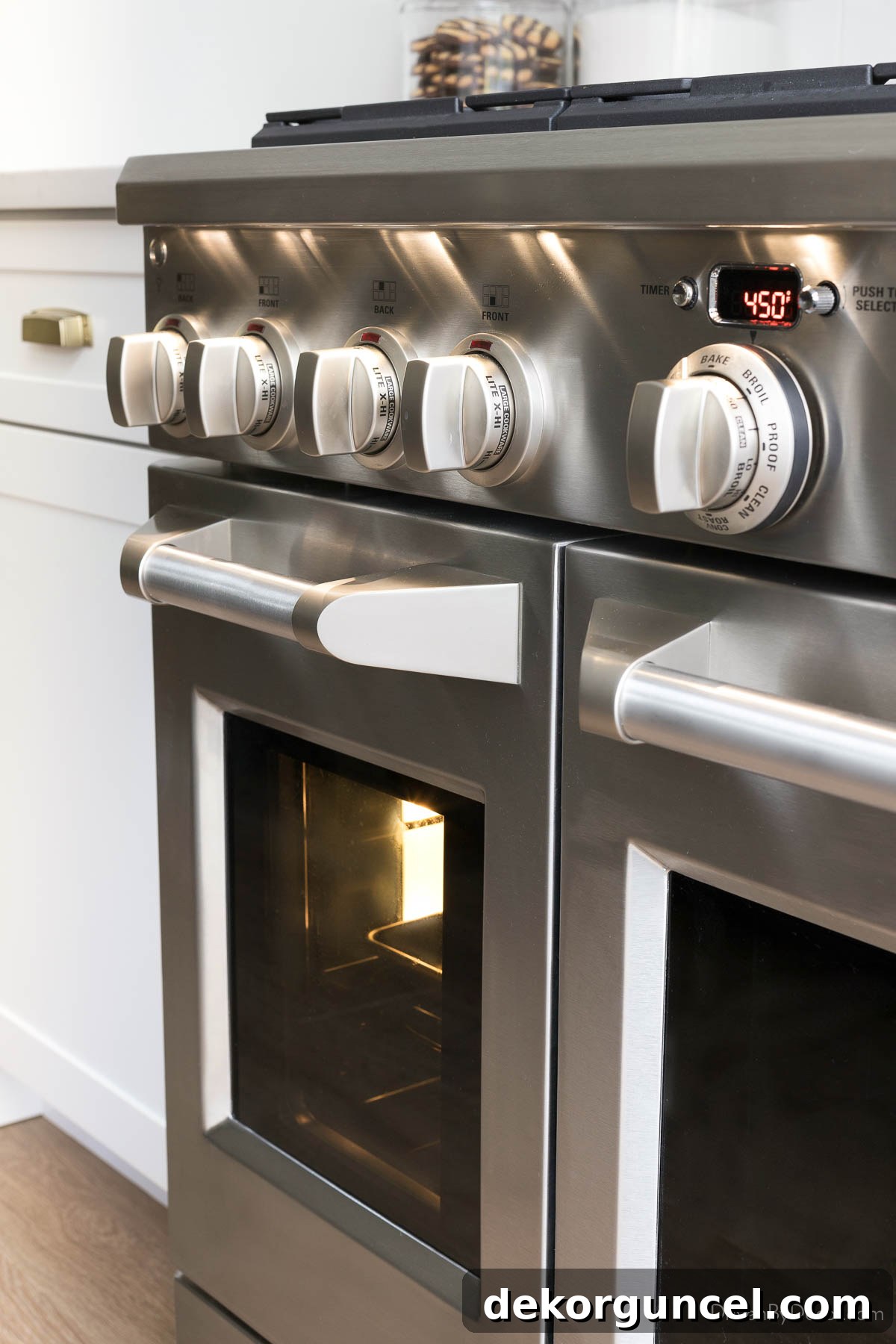 Induction Versus Gas Unlock Your Kitchens Potential 6 Close-up of the professional-grade knobs and handles from a Monogram gas range, showcasing quality craftsmanship.