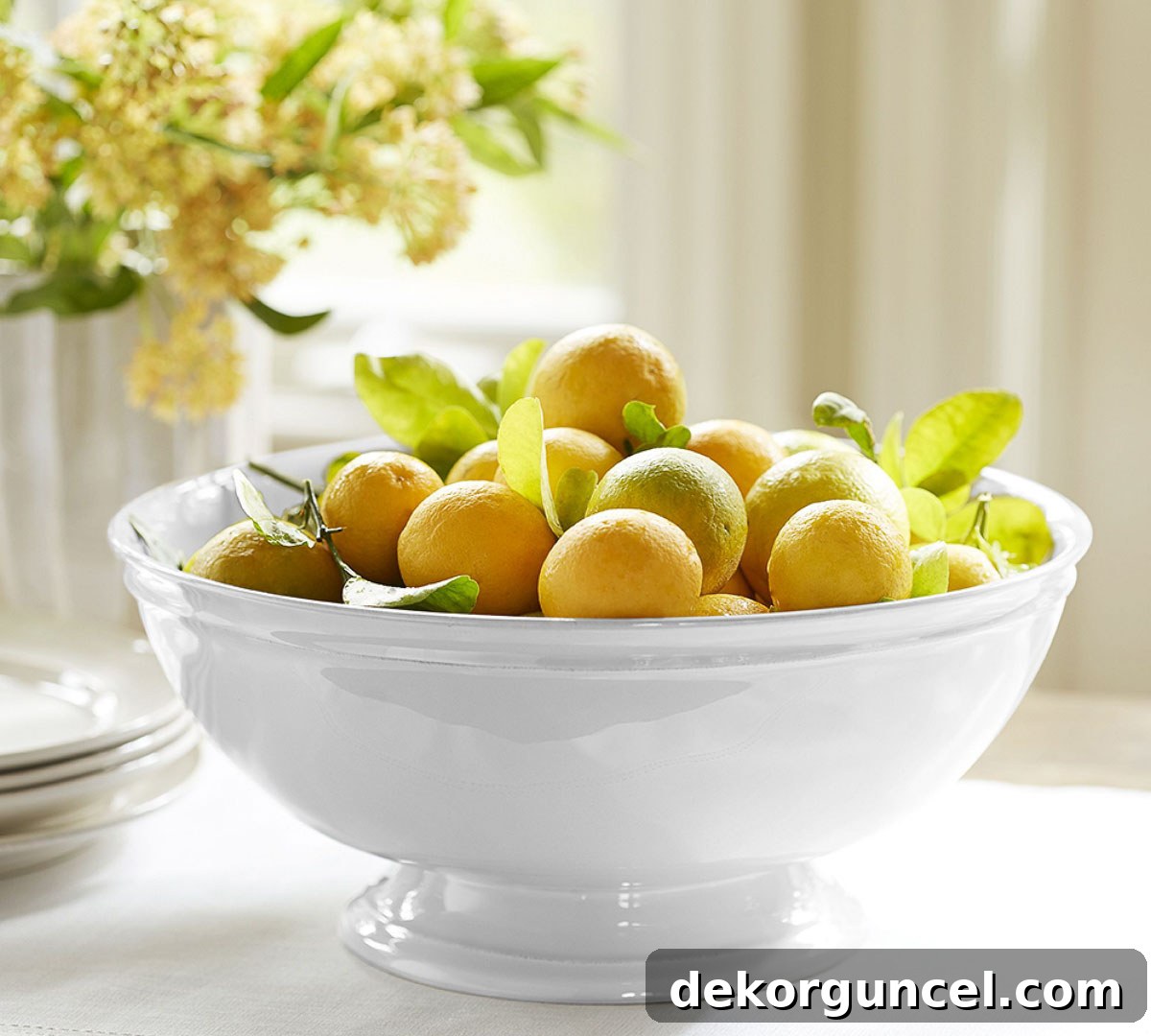 Everyday Dining Table Centerpiece Ideas 13 Vibrant faux lemons beautifully arranged in a large white bowl