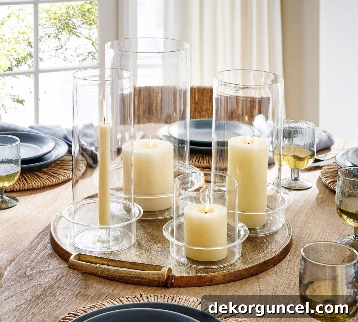 Everyday Dining Table Centerpiece Ideas 35 A sophisticated grouping of glass hurricanes on a tray, enhancing dining table decor