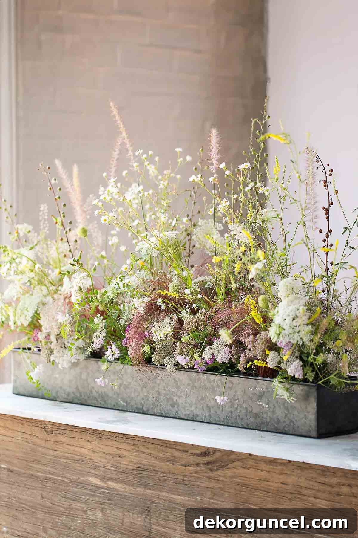 Everyday Dining Table Centerpiece Ideas 5 Silver trough filled with vibrant flowers as a rectangular dining table centerpiece