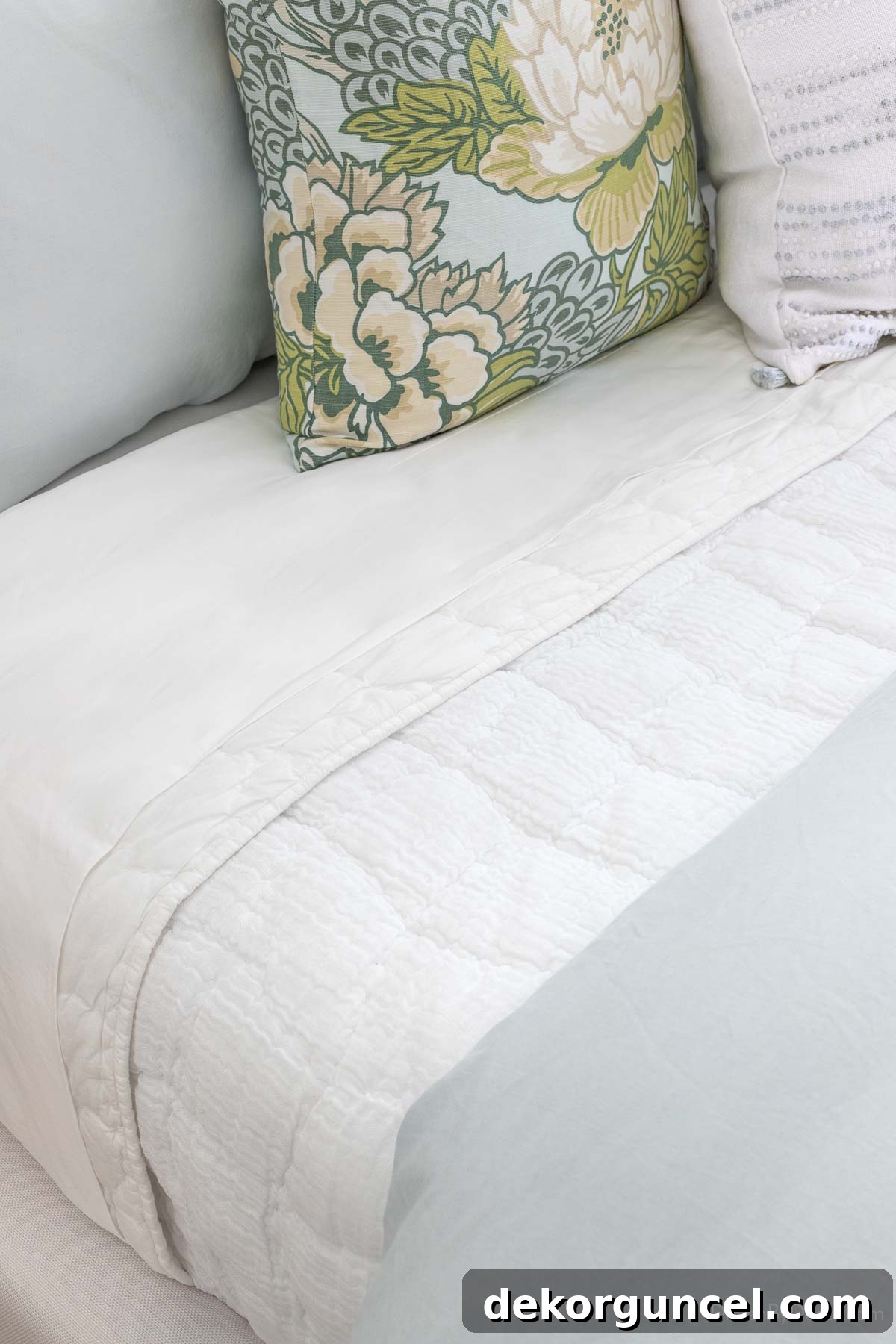 Cloud quilt layered between sheets and duvet