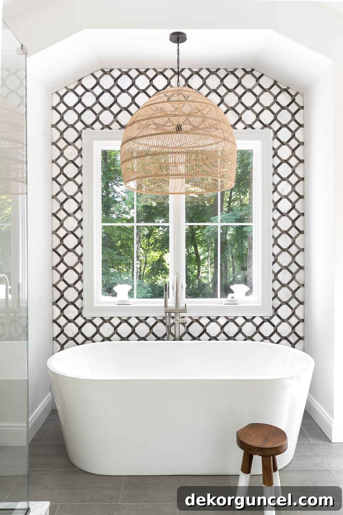 15 Budget-Friendly Bathroom Remodel Ideas 24 Tiling an accent wall behind bathtub as part of a budget bathroom remodel