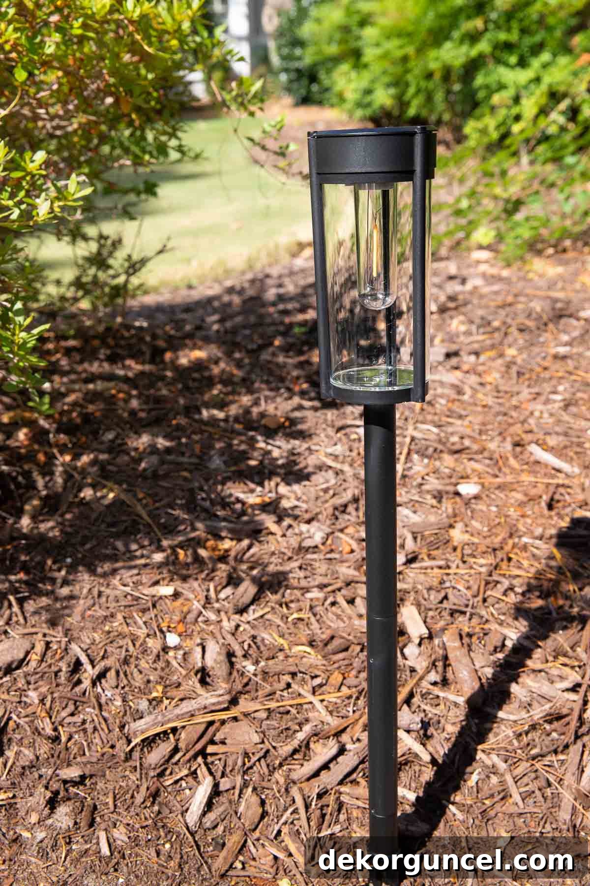10 Smart Buys for Affordable Home Style 14 A sleek solar pathway light, illuminating the path with soft, energy-efficient glow.