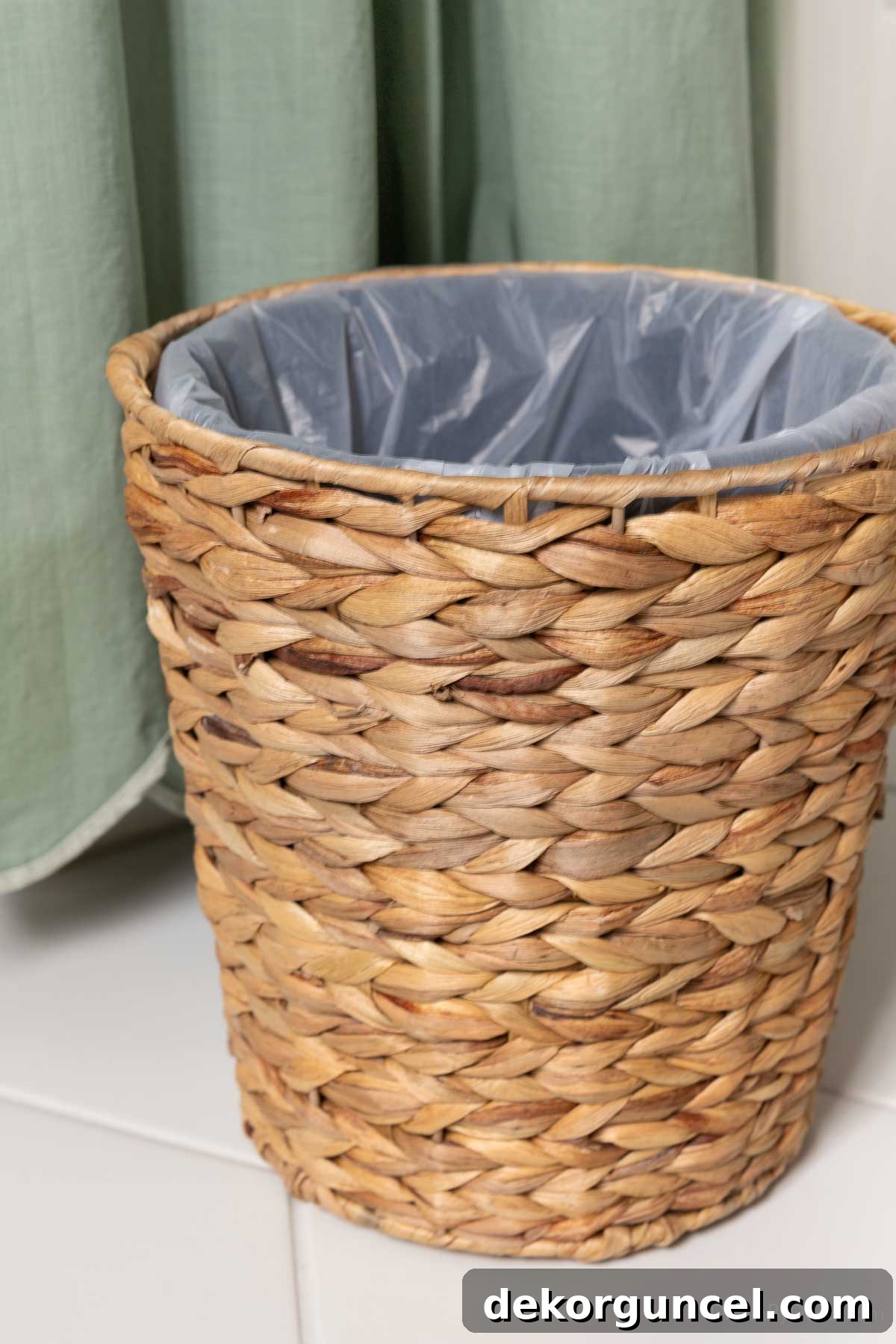 10 Smart Buys for Affordable Home Style 18 A small woven trash can, complete with a full-height plastic liner, blending style and functionality.