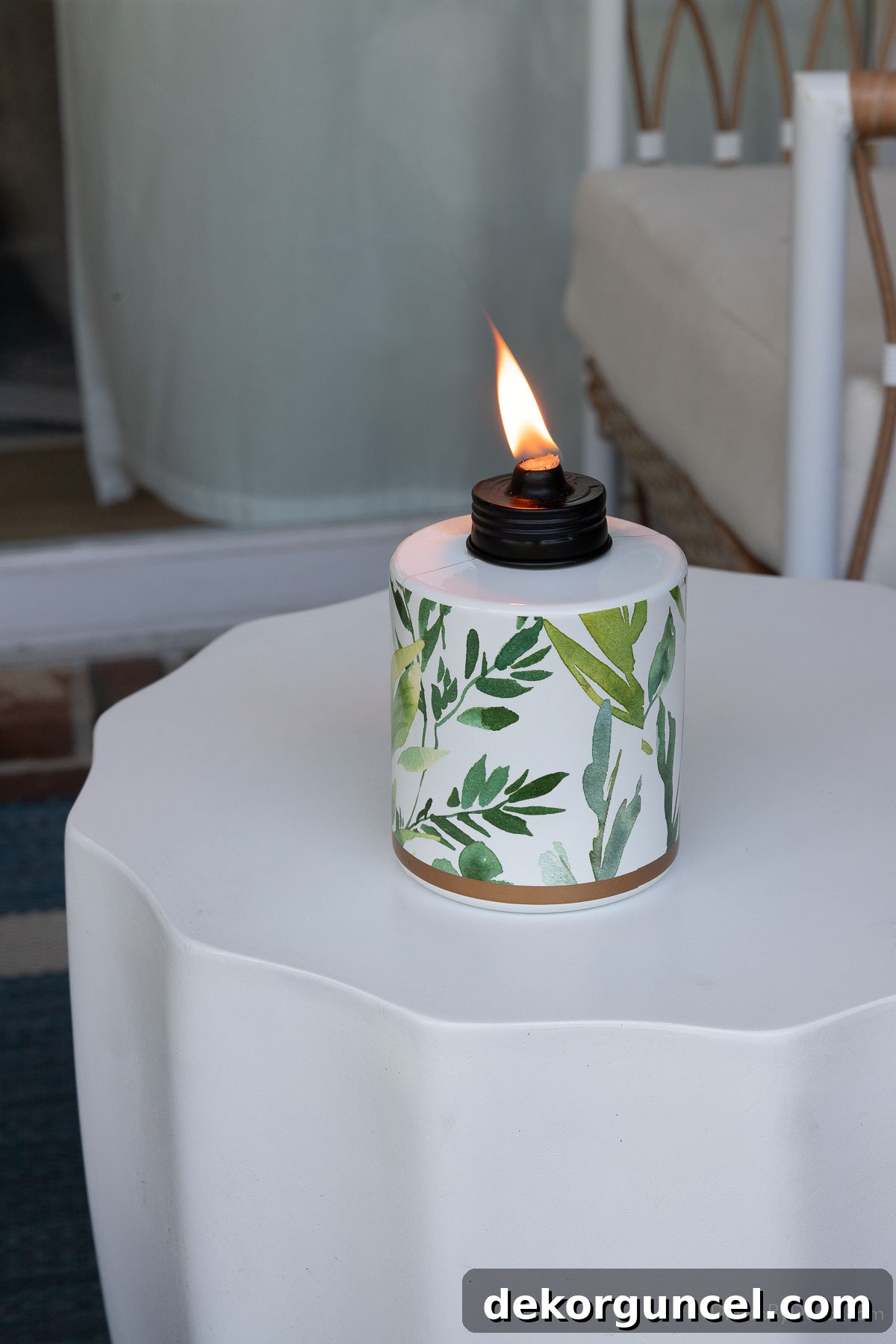 10 Smart Buys for Affordable Home Style 19 A tabletop tiki torch featuring an elegant greenery design, perfect for outdoor ambiance and bug control.
