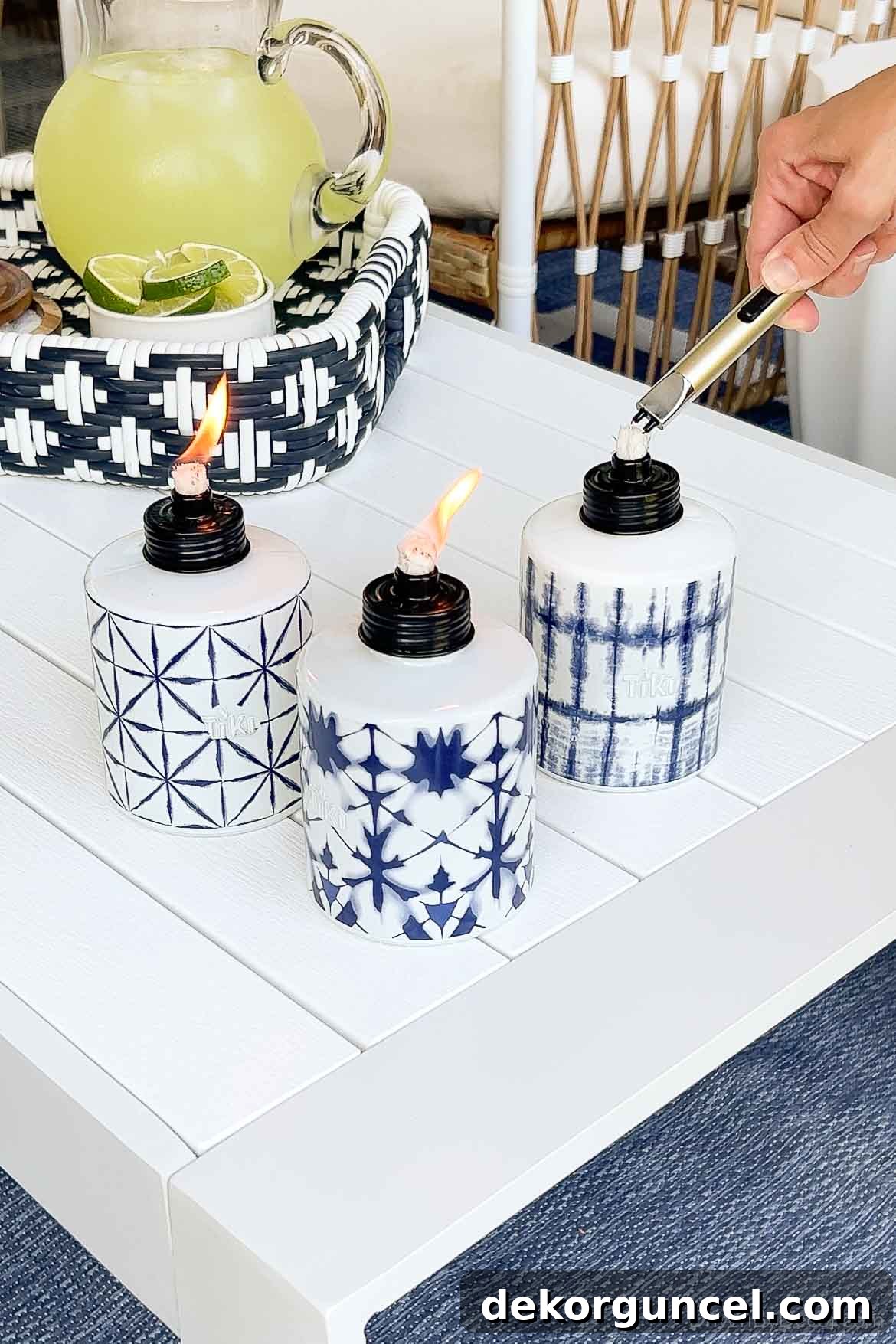10 Smart Buys for Affordable Home Style 20 Three outdoor tiki torches with blue patterns, effectively repelling bugs while adding decorative flair.