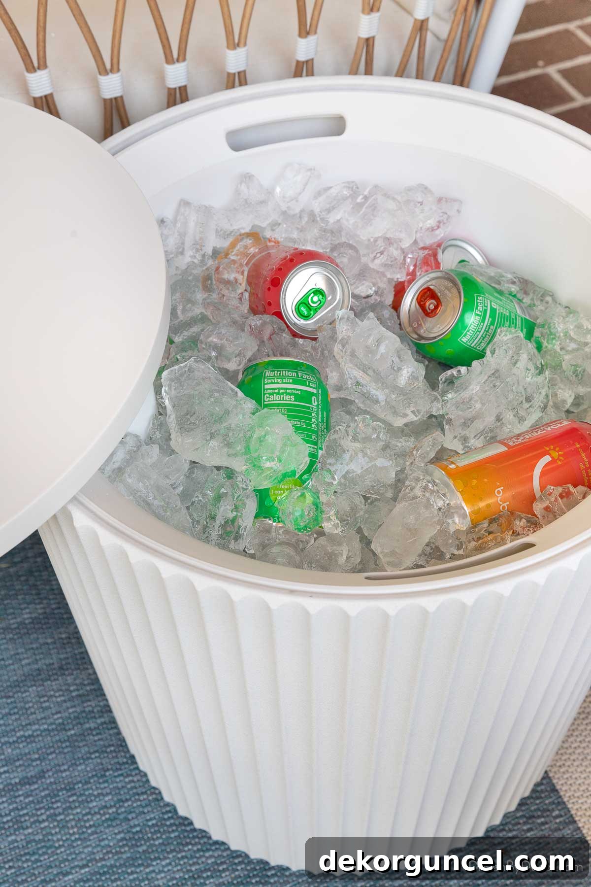 10 Smart Buys for Affordable Home Style 22 The outdoor side table's top swiveled open, revealing a cooler interior filled with ice and refreshing drinks.
