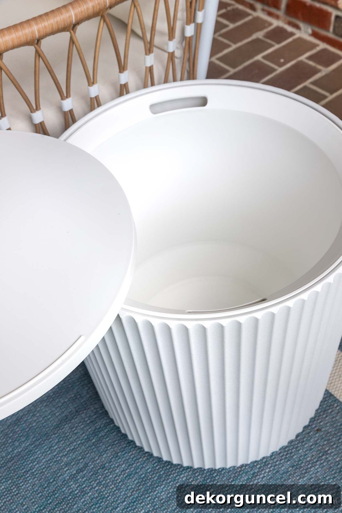 10 Smart Buys for Affordable Home Style 23 The versatile outdoor side table, with its top lifted to showcase generous internal storage space.