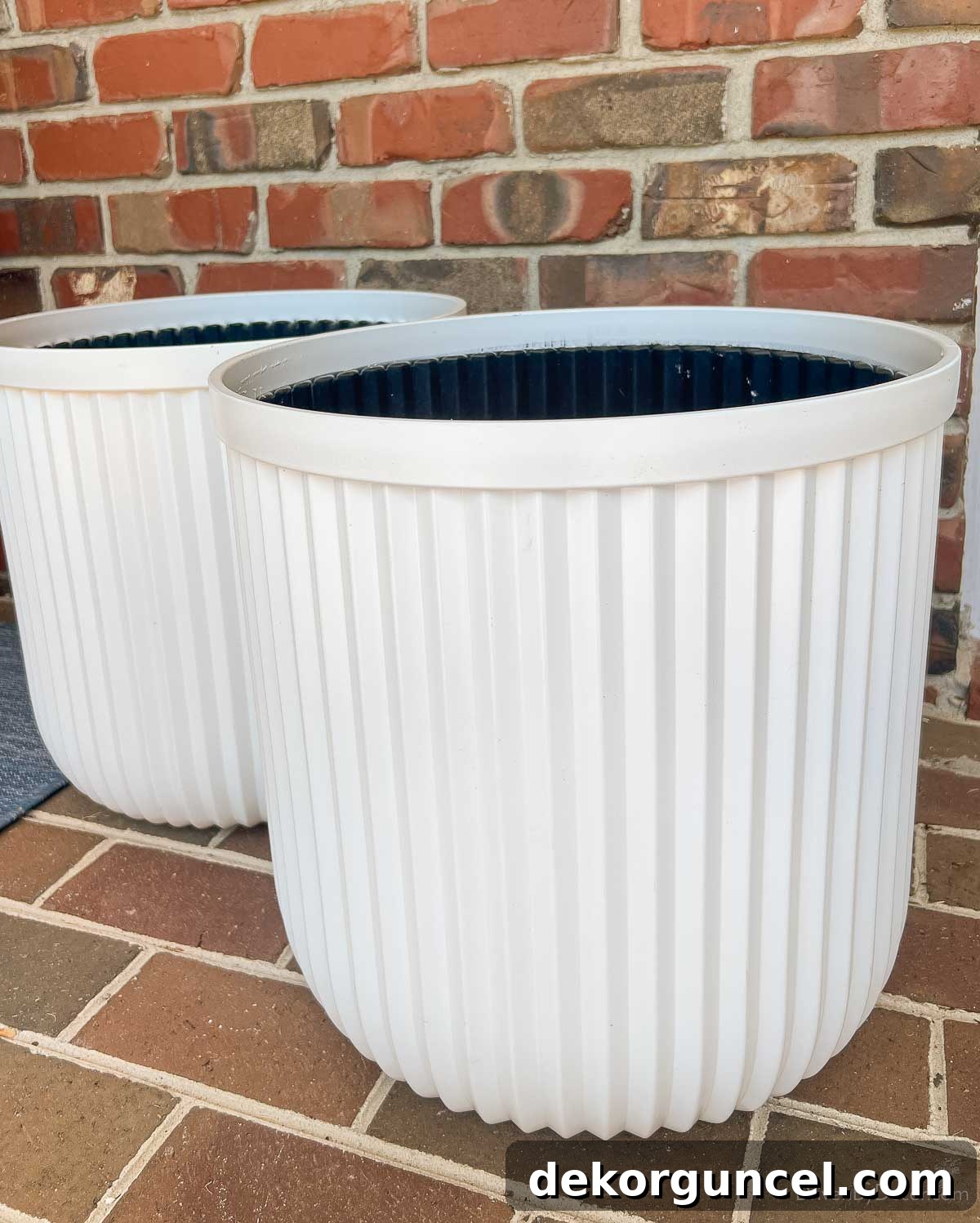 10 Smart Buys for Affordable Home Style 6 A pair of elegant large fluted outdoor planters, perfect for adding sophistication to any exterior space.