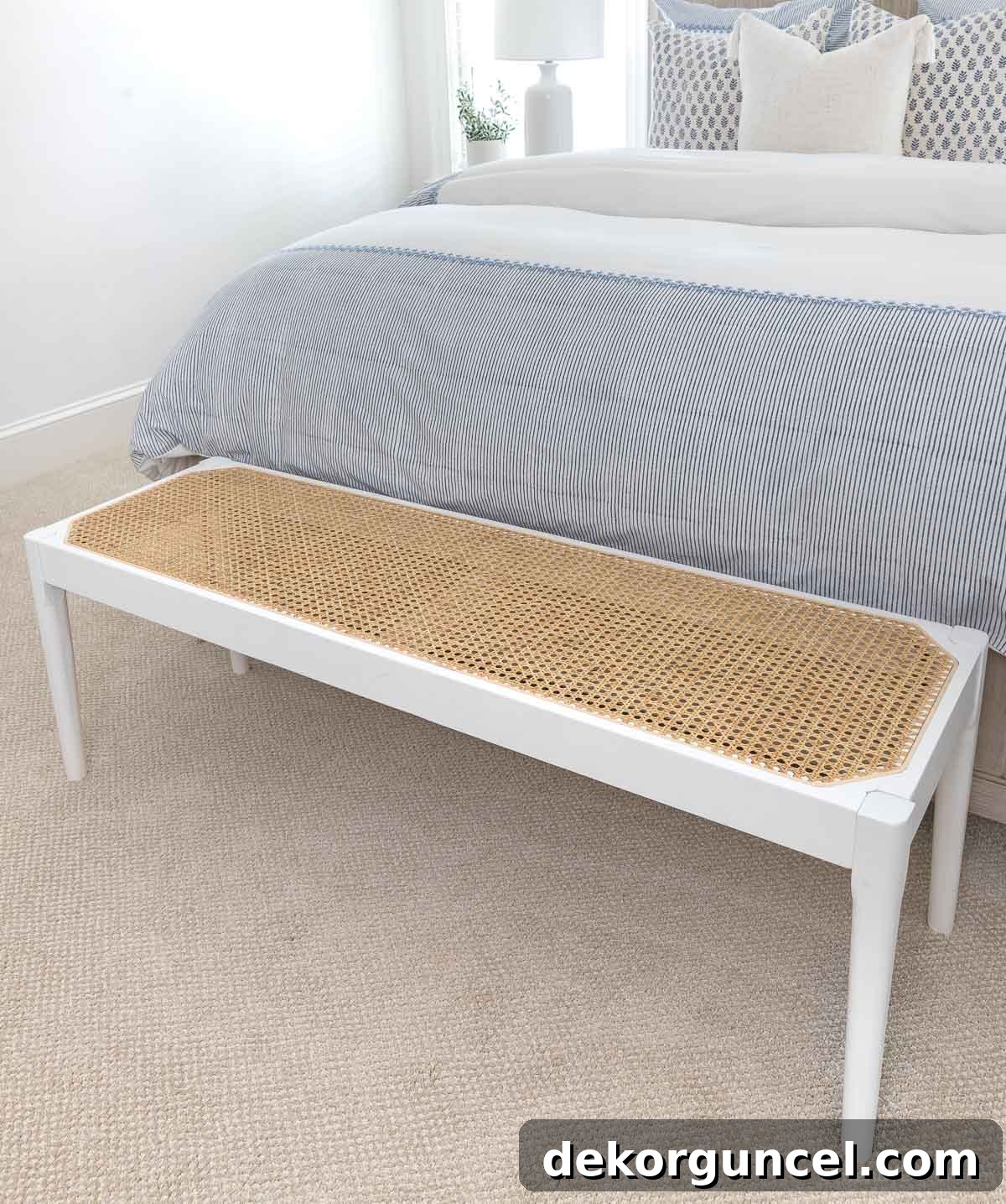 Curate Your Cozy Corner 10 Stylish Bedroom Updates 8 Cane bench at end of bed as a coastal bedroom decor idea