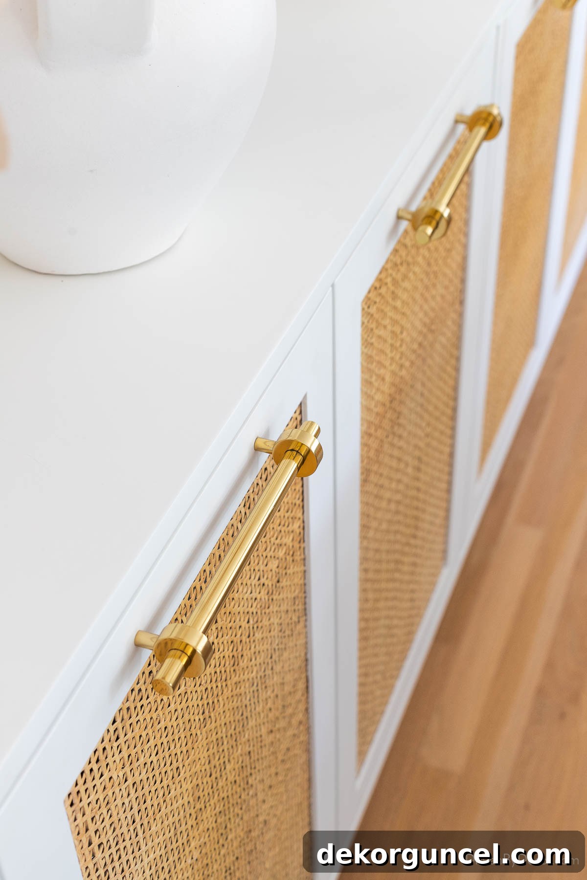 Close-up of brass pulls on dining room console