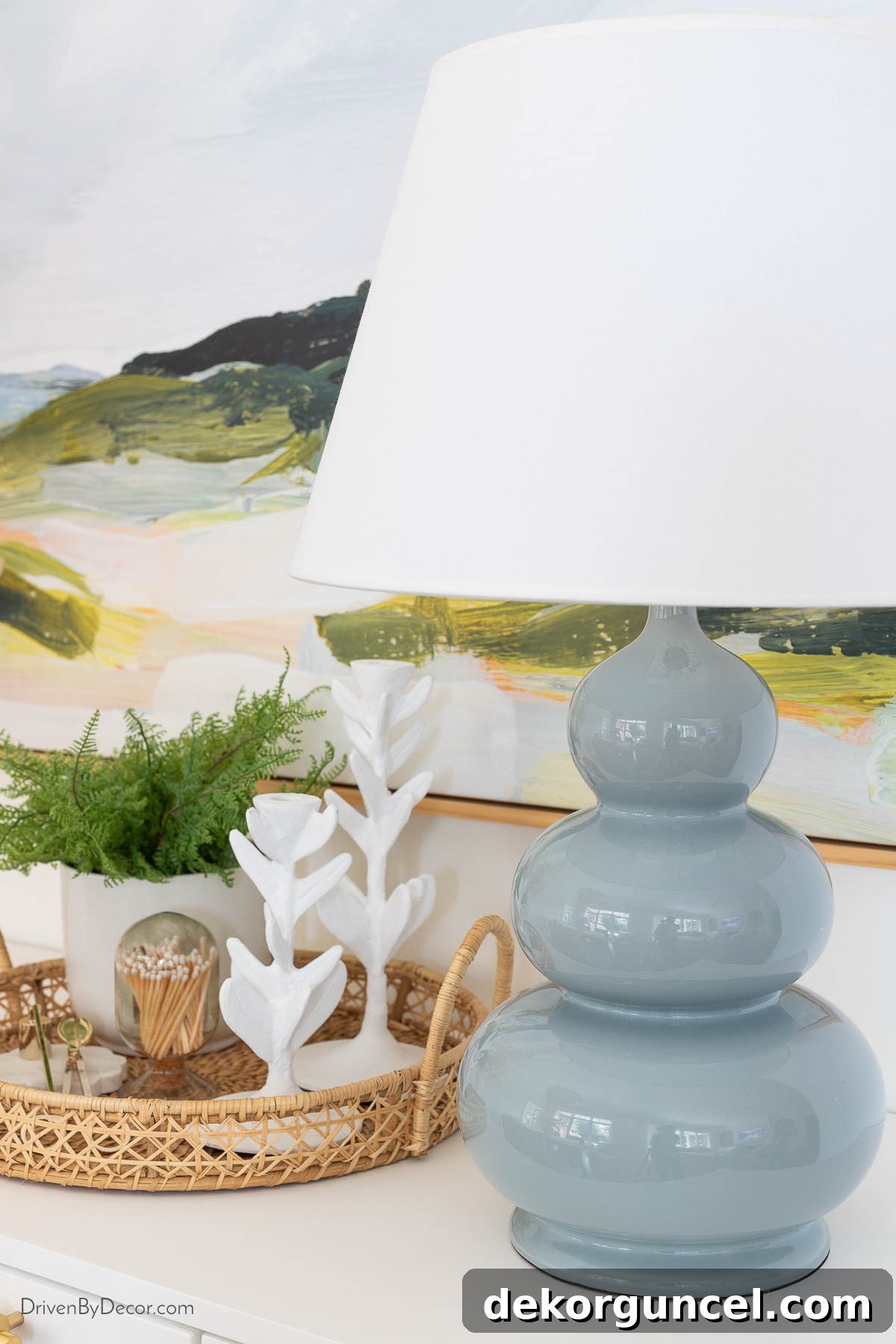 Blue gourd lamp and styled accessories on dining room console