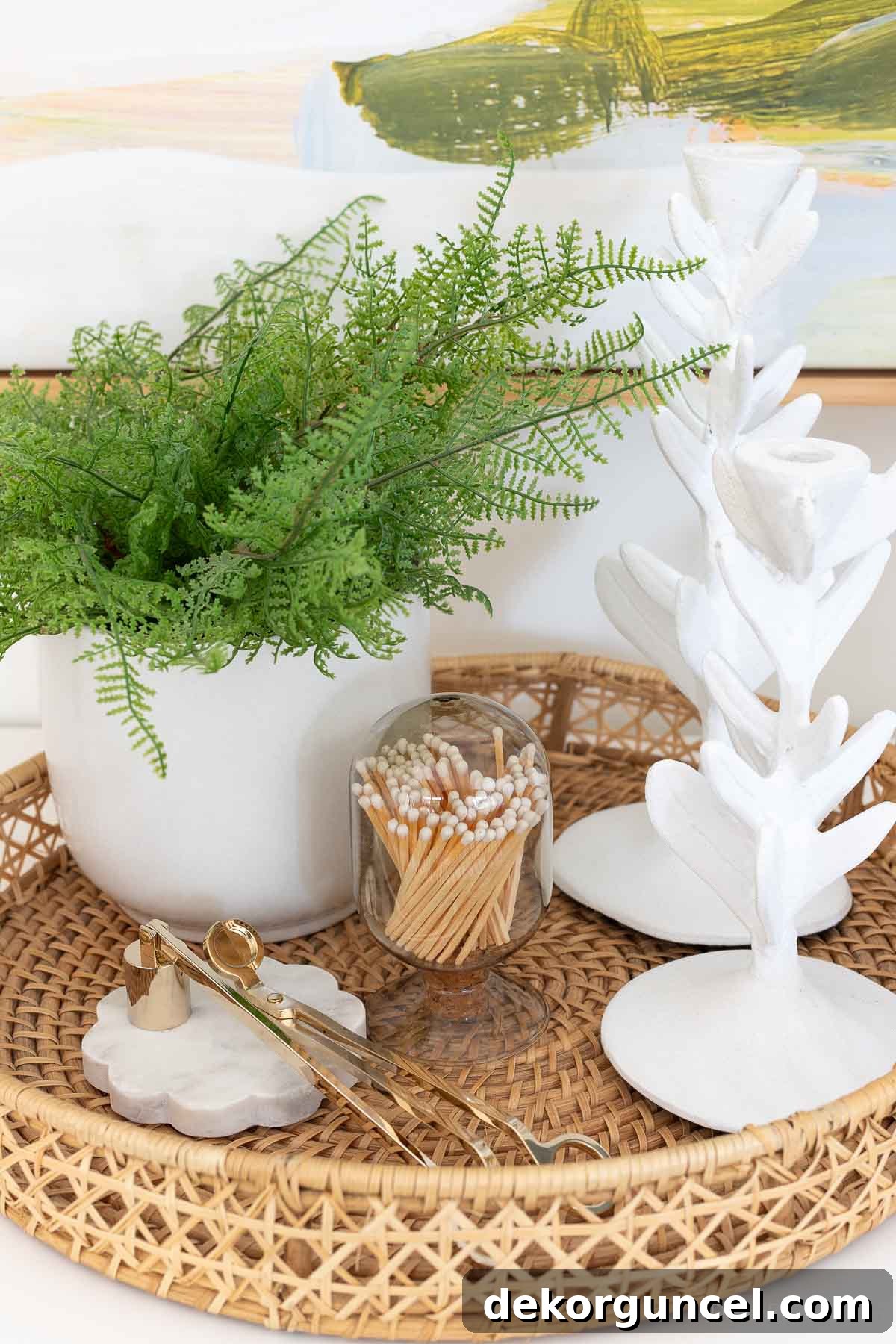 Styled round woven tray with decorative accessories