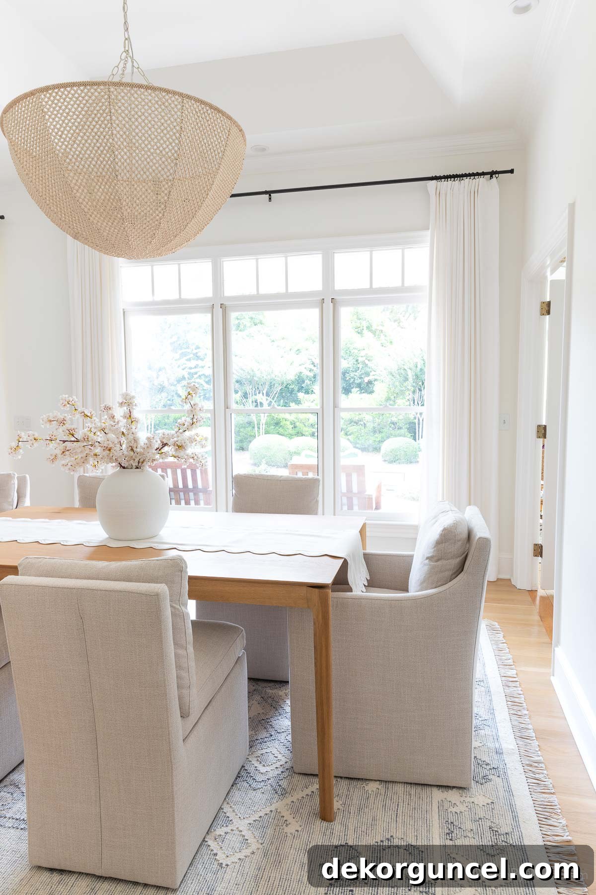 White curtains gracefully framing dining room windows