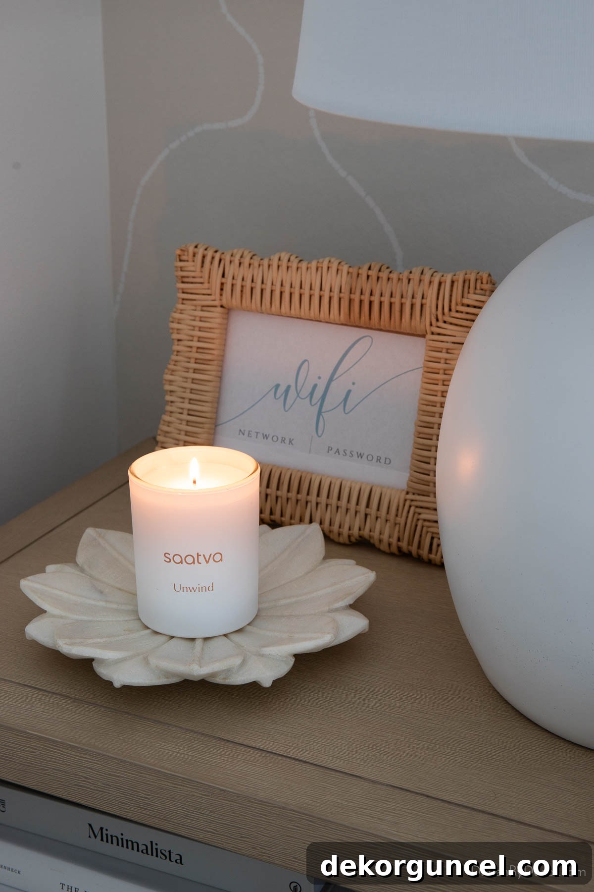 Your Complete Mattress Guide: Shopping, Cleaning, and Care 12 Lighted Saatva candle on nightstand