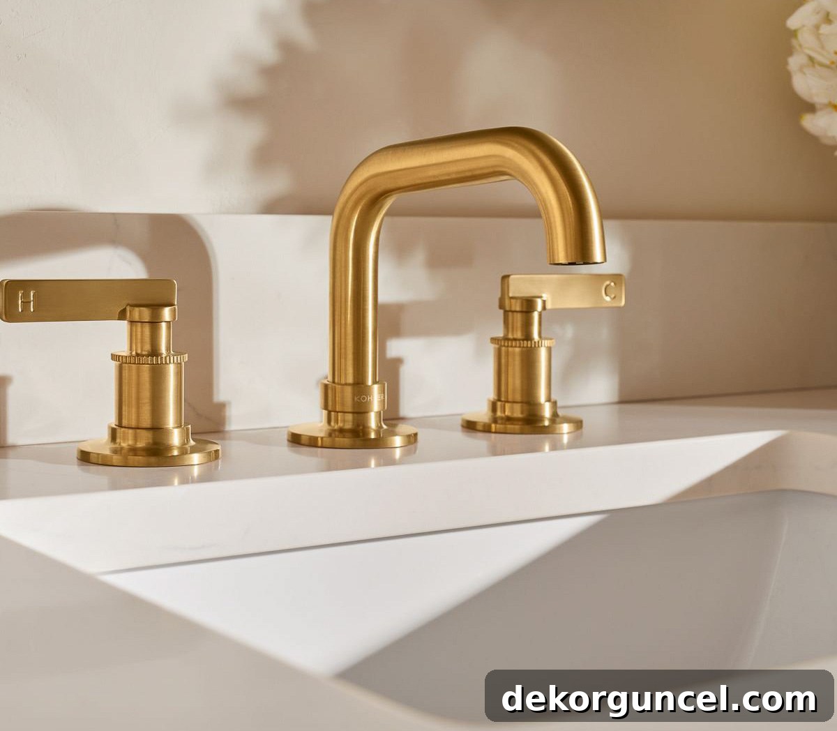 Kohler Studio McGee bathroom faucet in vibrant brushed gold