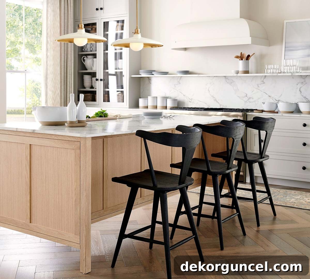 Kitchen island pendant lights with a saucer shape, featuring steel shades and brass downrods for a modern look.