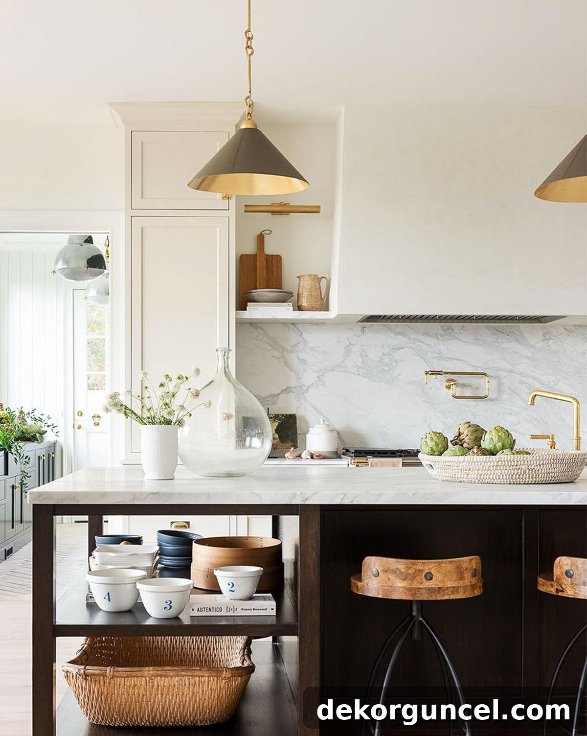 Small, stylish leather-wrapped cone pendants casting focused light over a kitchen island, showcasing a popular trend in lighting design.