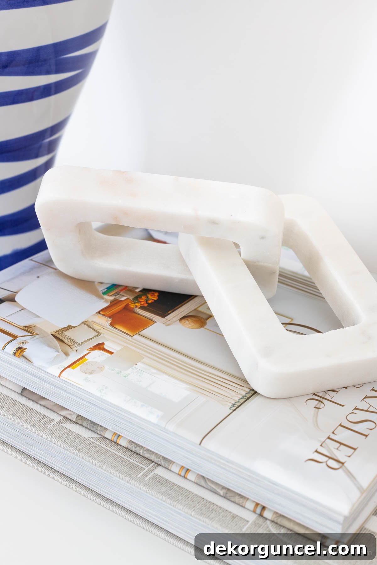 Easy Dresser Styling Ideas 8 Decorative marble chain on a stack of books